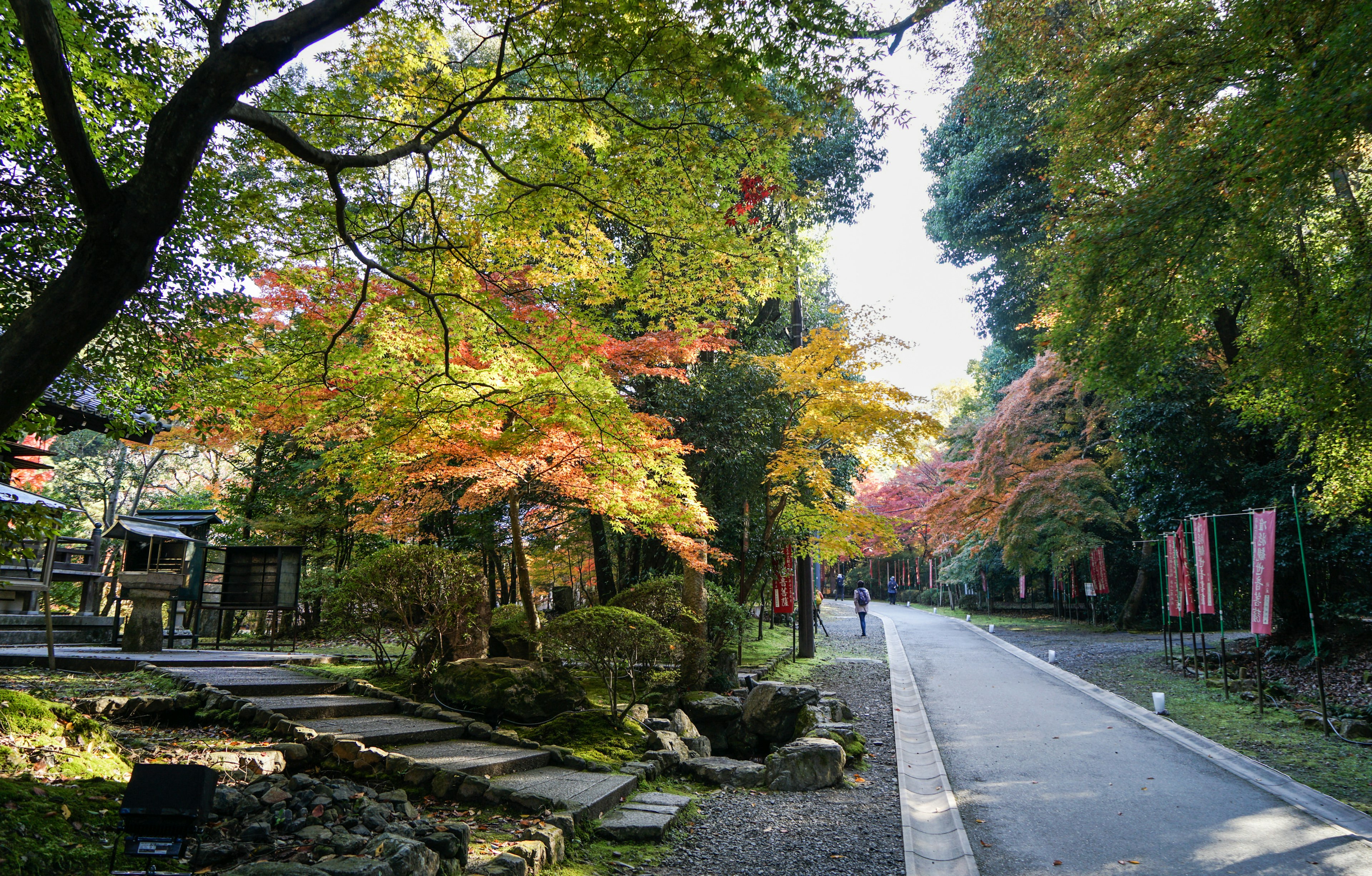 Kyoto, Japan - Nov 18, 2016. People walking at the garden of Shinto Shrine in Kyoto, Japan. Kyoto is famous for its numerous classical Buddhist temples, as well as gardens, imperial palaces.