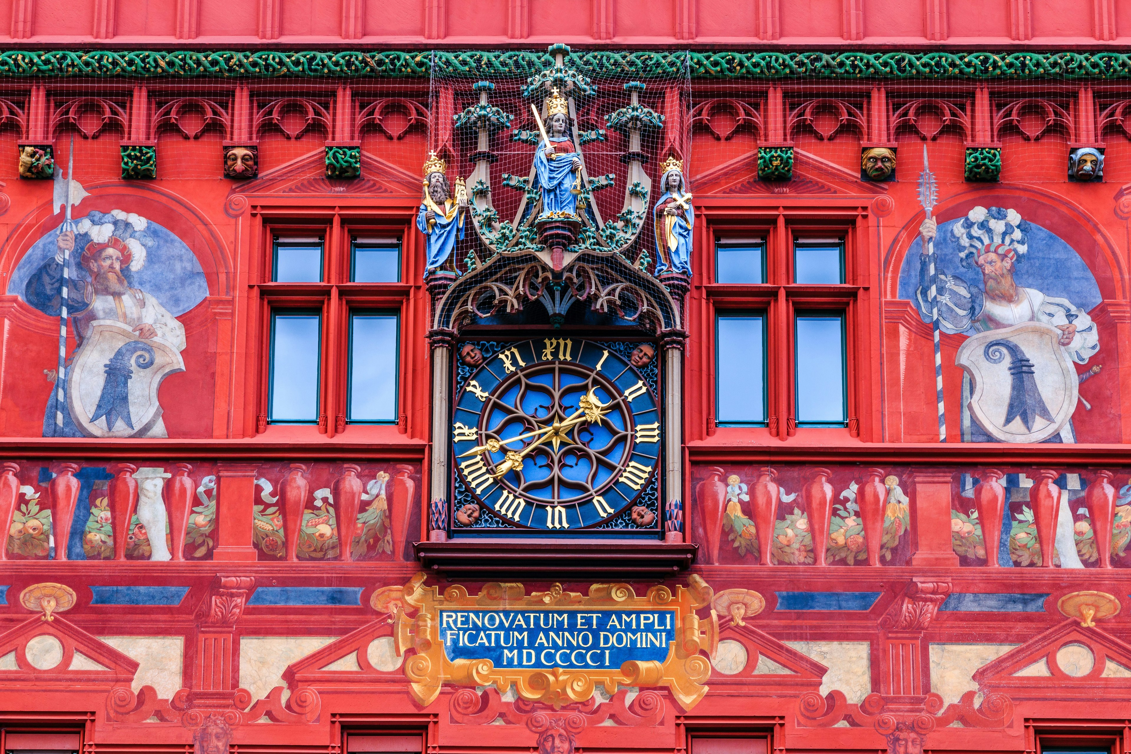 Detail of the historic town hall clock in Basel, Switzerland.