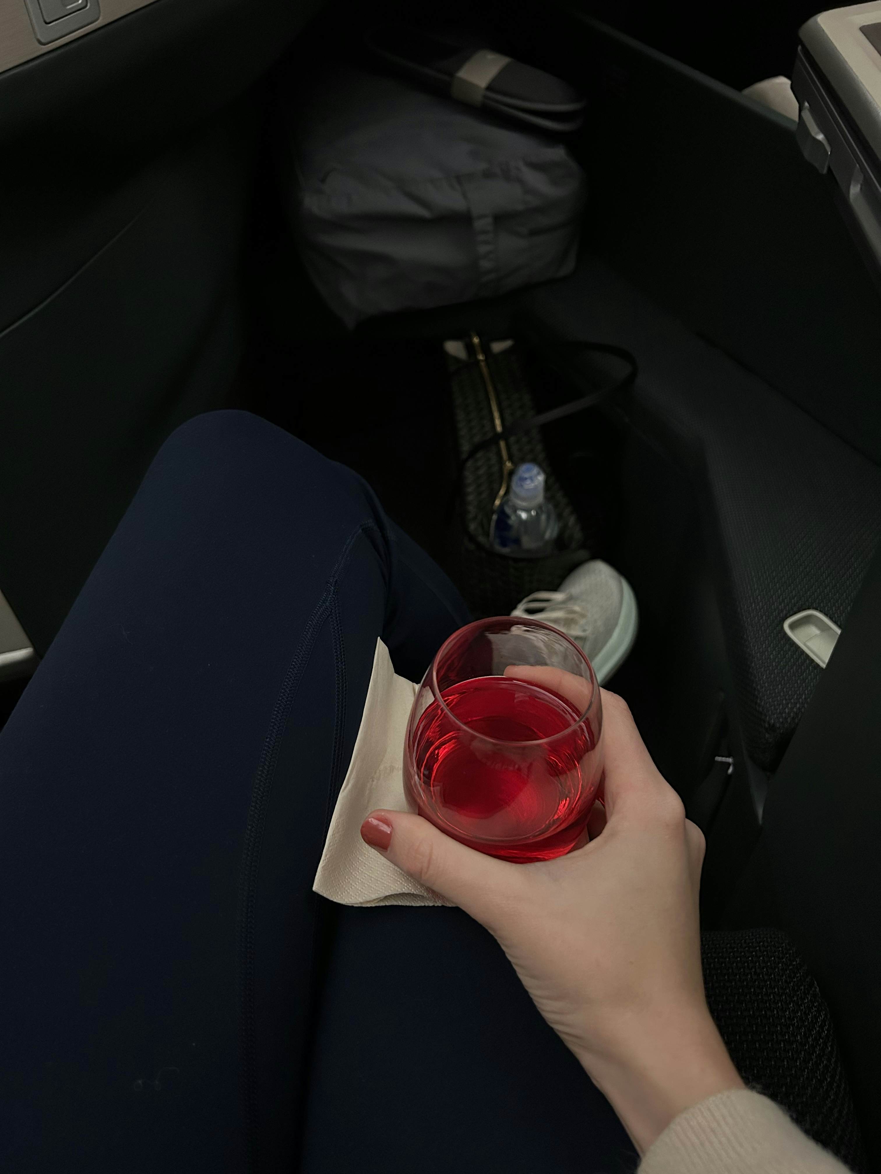 having a drink on the plane