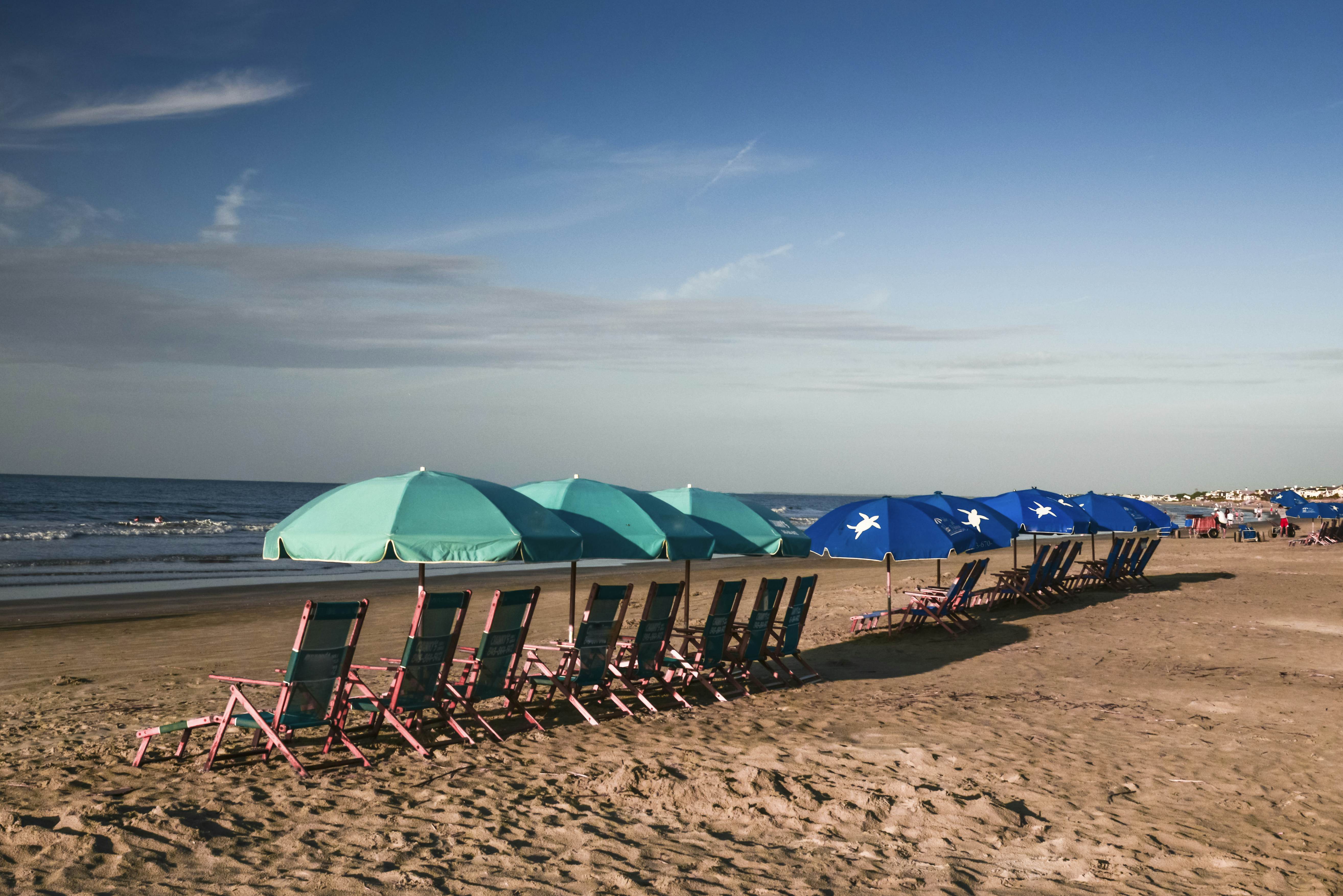 Beach Umbrellas await vacationers in early morning on the Isle of Palms, South Carolina.