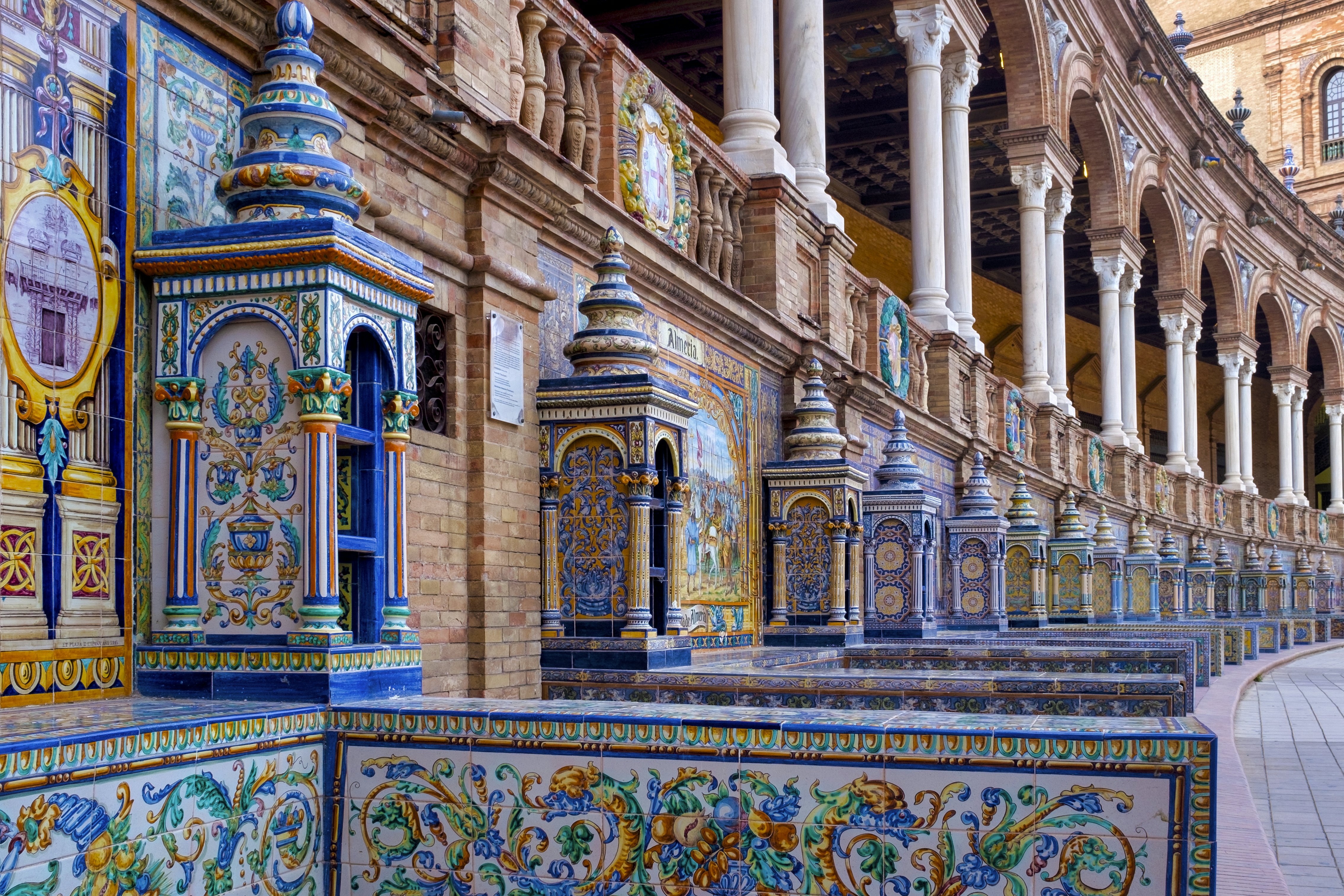 The tiled Provincial Alcoves along the walls of the Plaza de España.