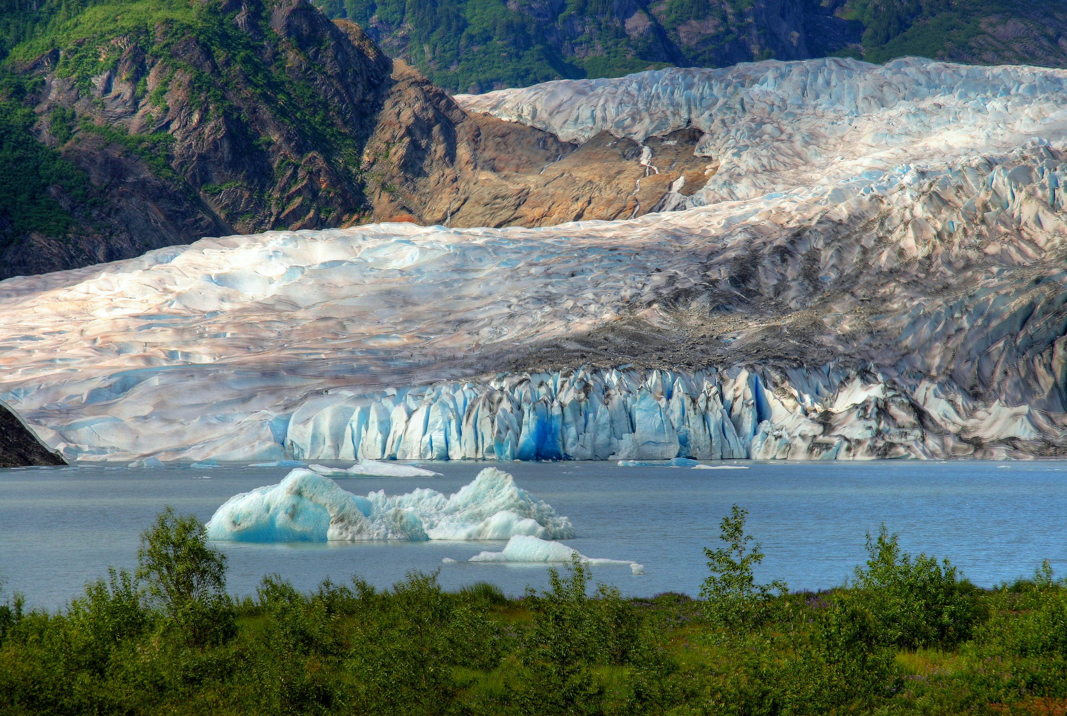 Icebergs calving at the edge of the Mendenhall Glacier near Juneau, Alaska.