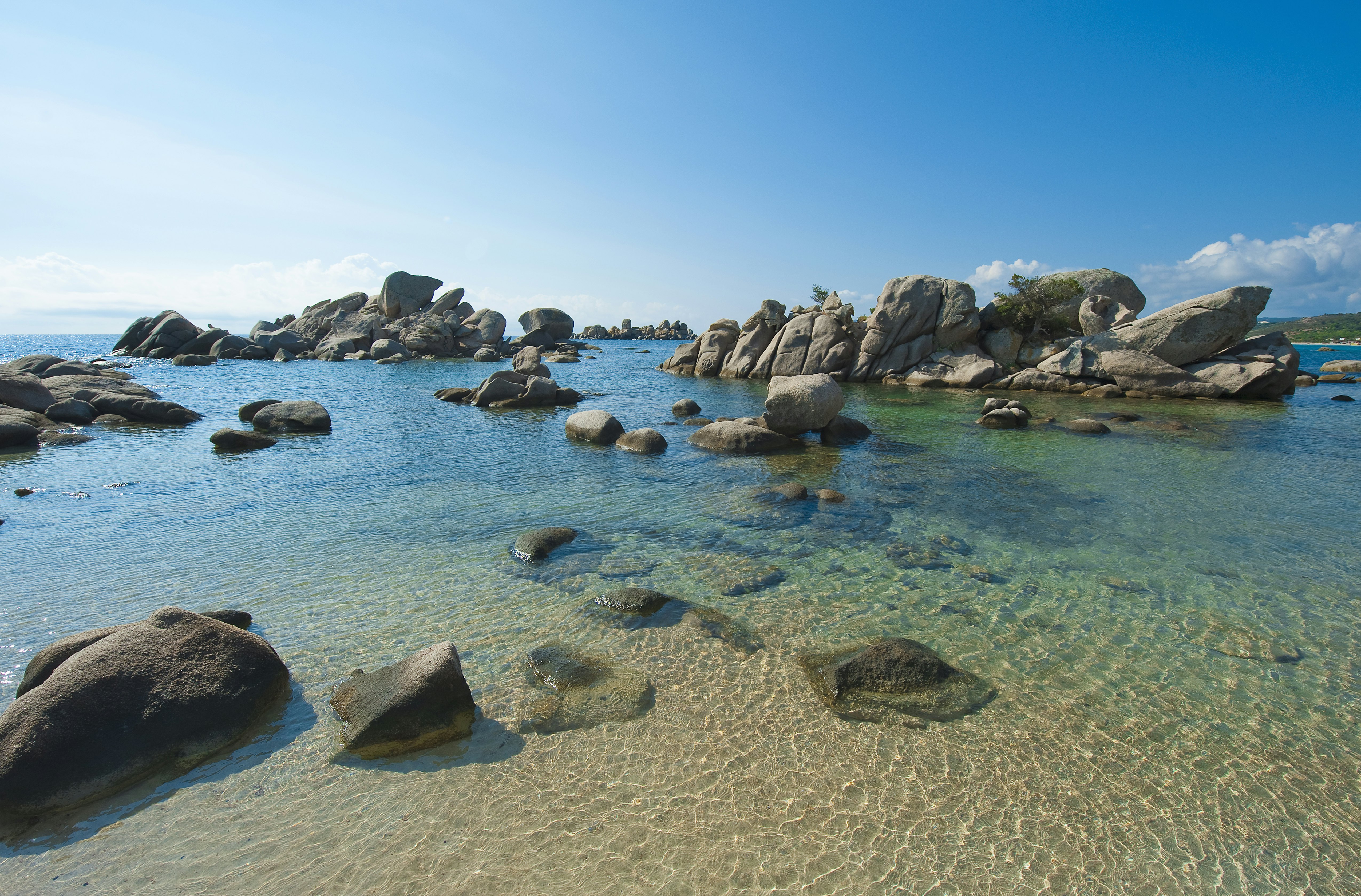 Rocks in the water at Palombaggia Beach, Corsica.