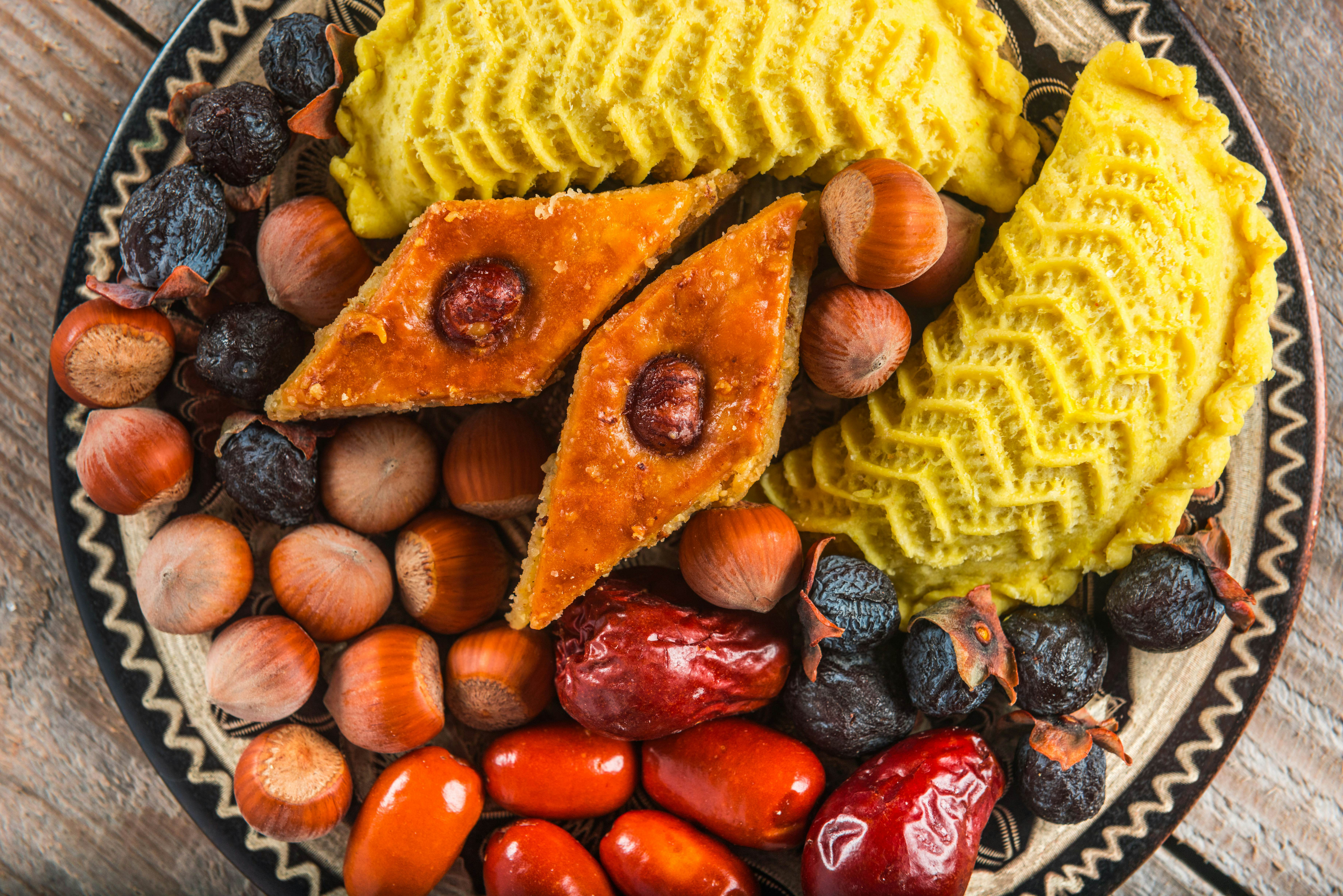 Sweet treats and snacks laid out on a platter for Novruz in Azerbaijan.