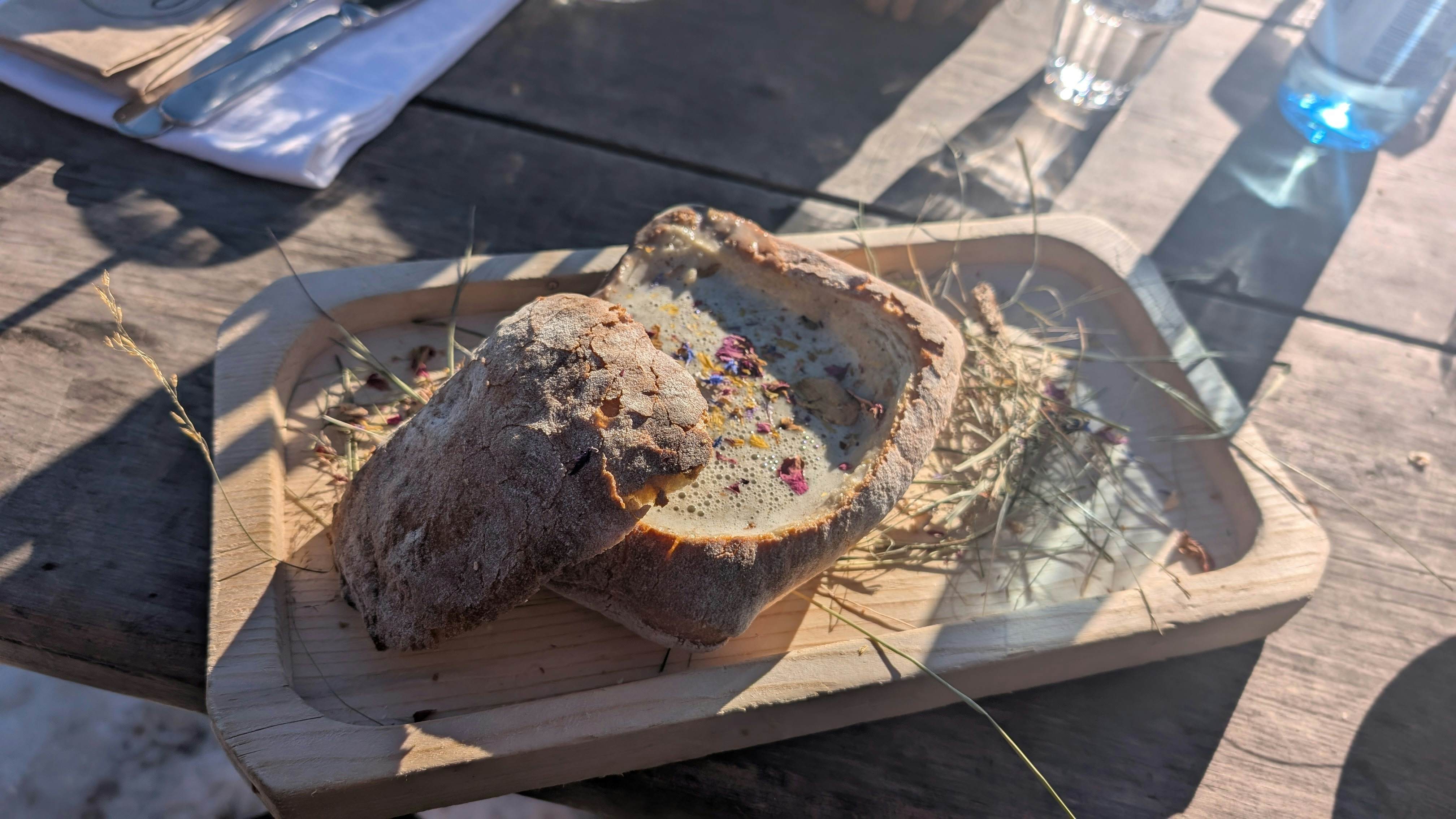 A bowl of Heublütensuppen at Gostner Schwaige in the Dolomites, Italy