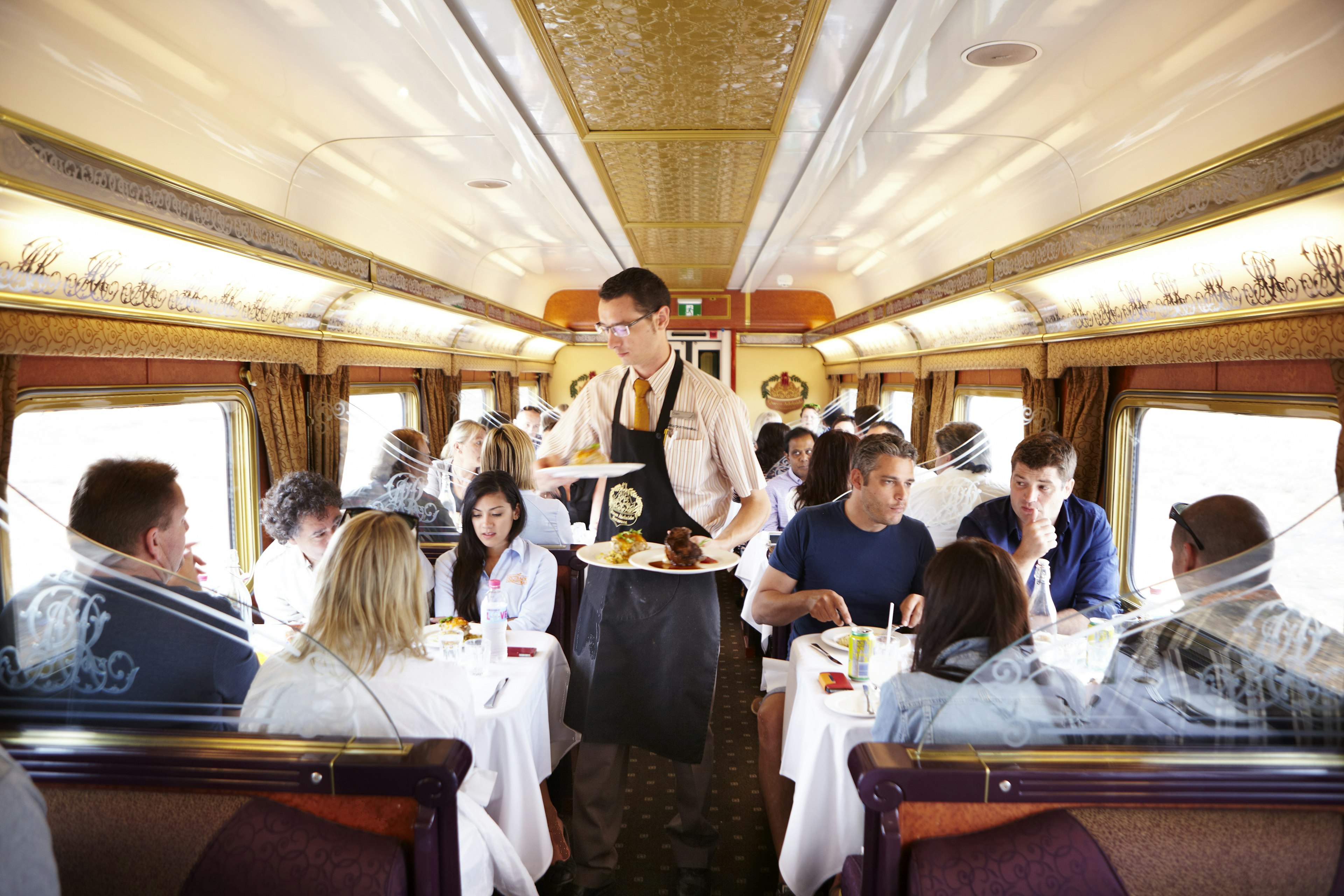 Lunch is served to Gold and Platinum Service passengers in the Queen Adelaide Restaurant Car onboard the Indian Pacific train.