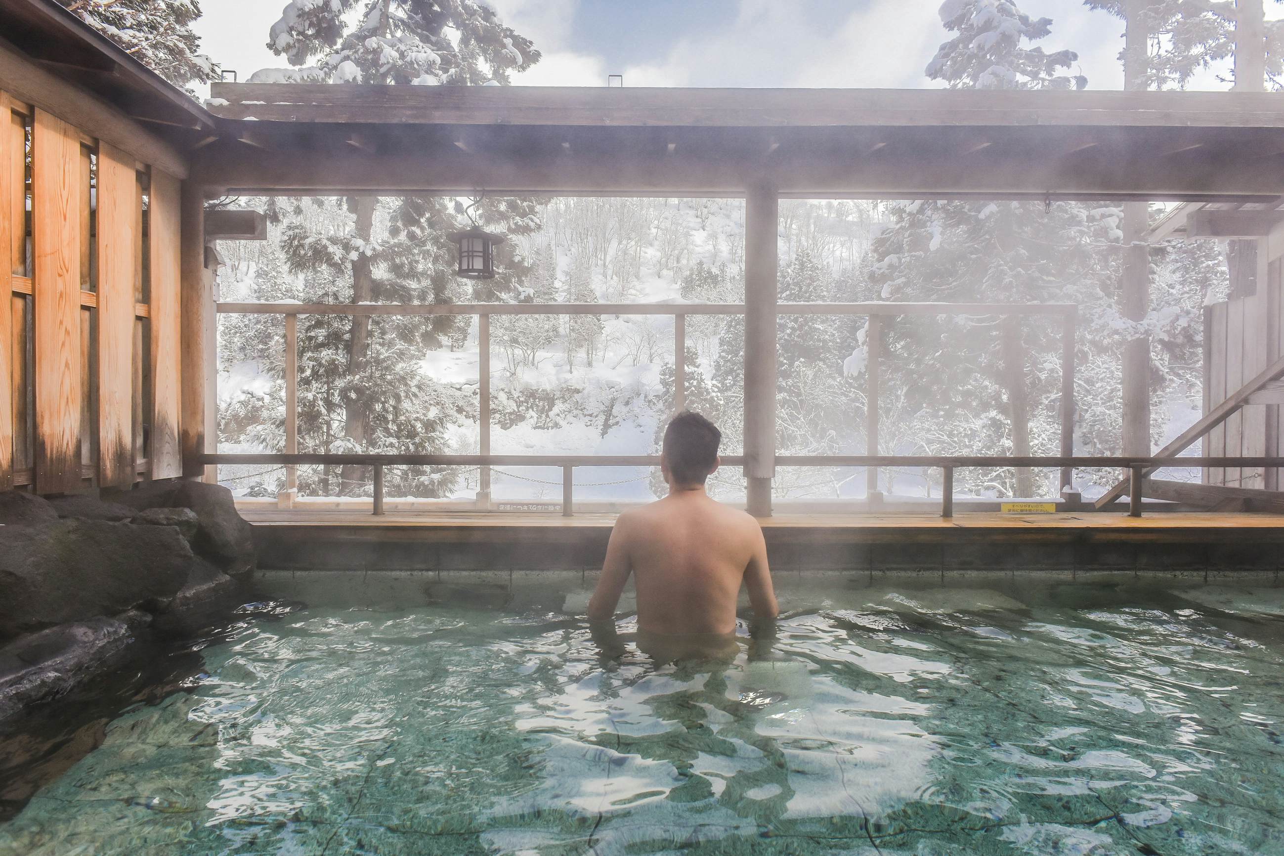 Steaming Outdoor Onsen (Hot Spring) With Snow in Winter at a Ryokan of Zao Hot Spring, Yamagata , Japan.