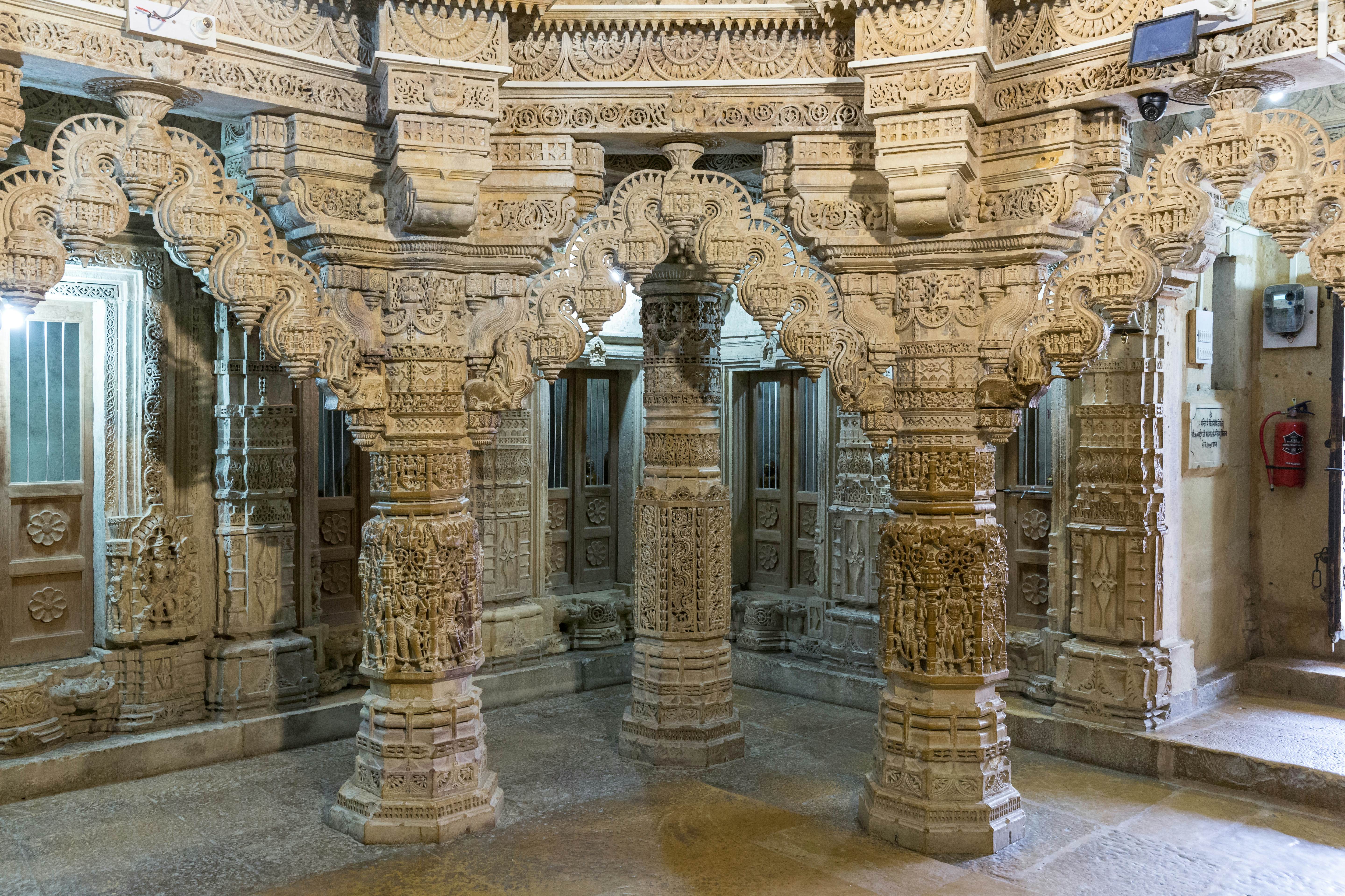 Ornate carved walls and columns in a temple within a fortress