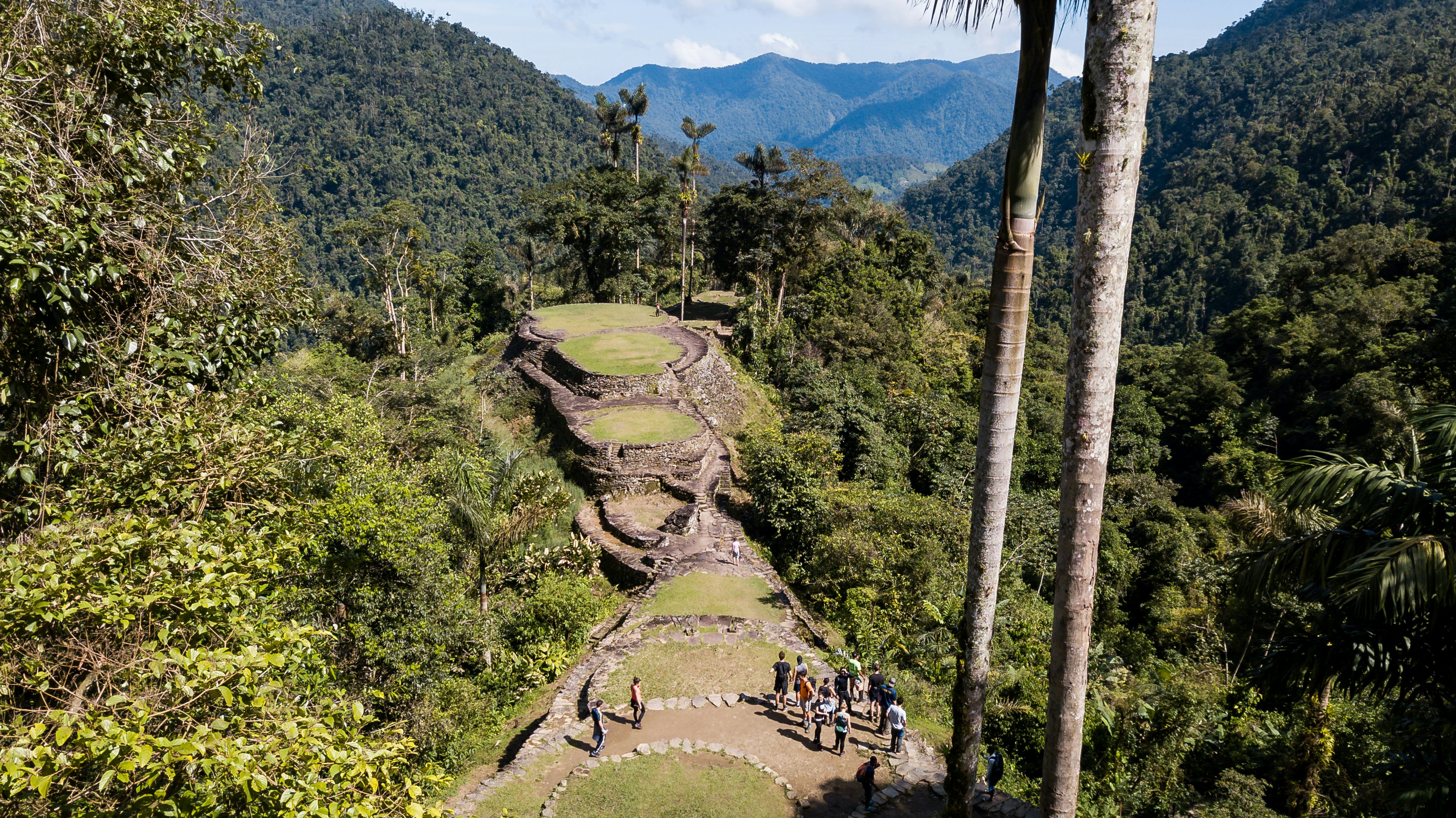 Group of tourists visiting the ancient archeological site Lost City, Ciudad Perdida