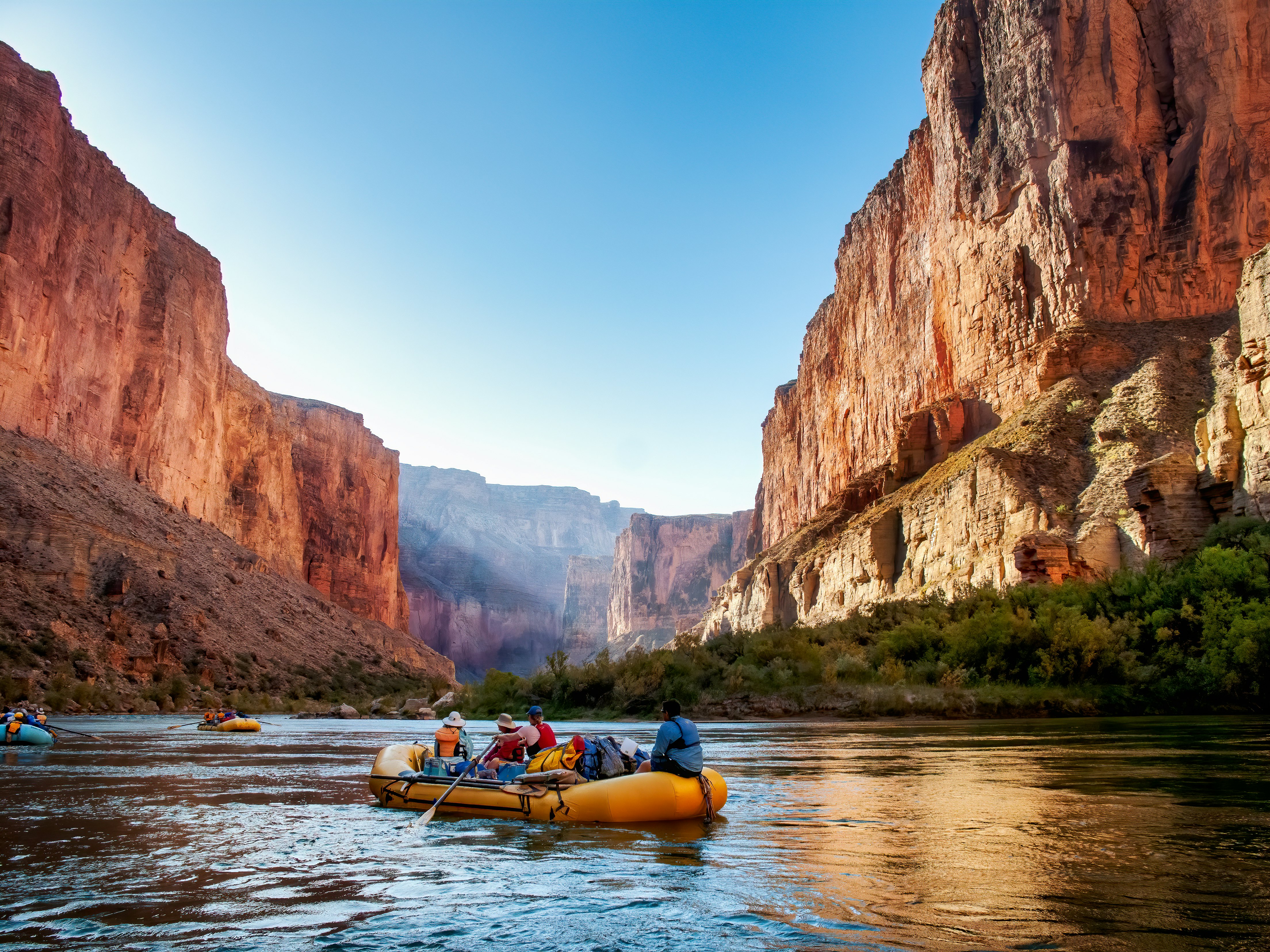 Rafting on the Colorado River in the Grand Canyon at sunrise.