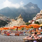 POSITANO-MAY 13: Unidentified people enjoy the beach of Amalfi coast on May 13, 2012. From 1997 Positano is part of UNESCO World Heritage. License Type: media Download Time: 2023-07-12T01:25:14.000Z User: hannahblackie10 Is Editorial: Yes purchase_order: