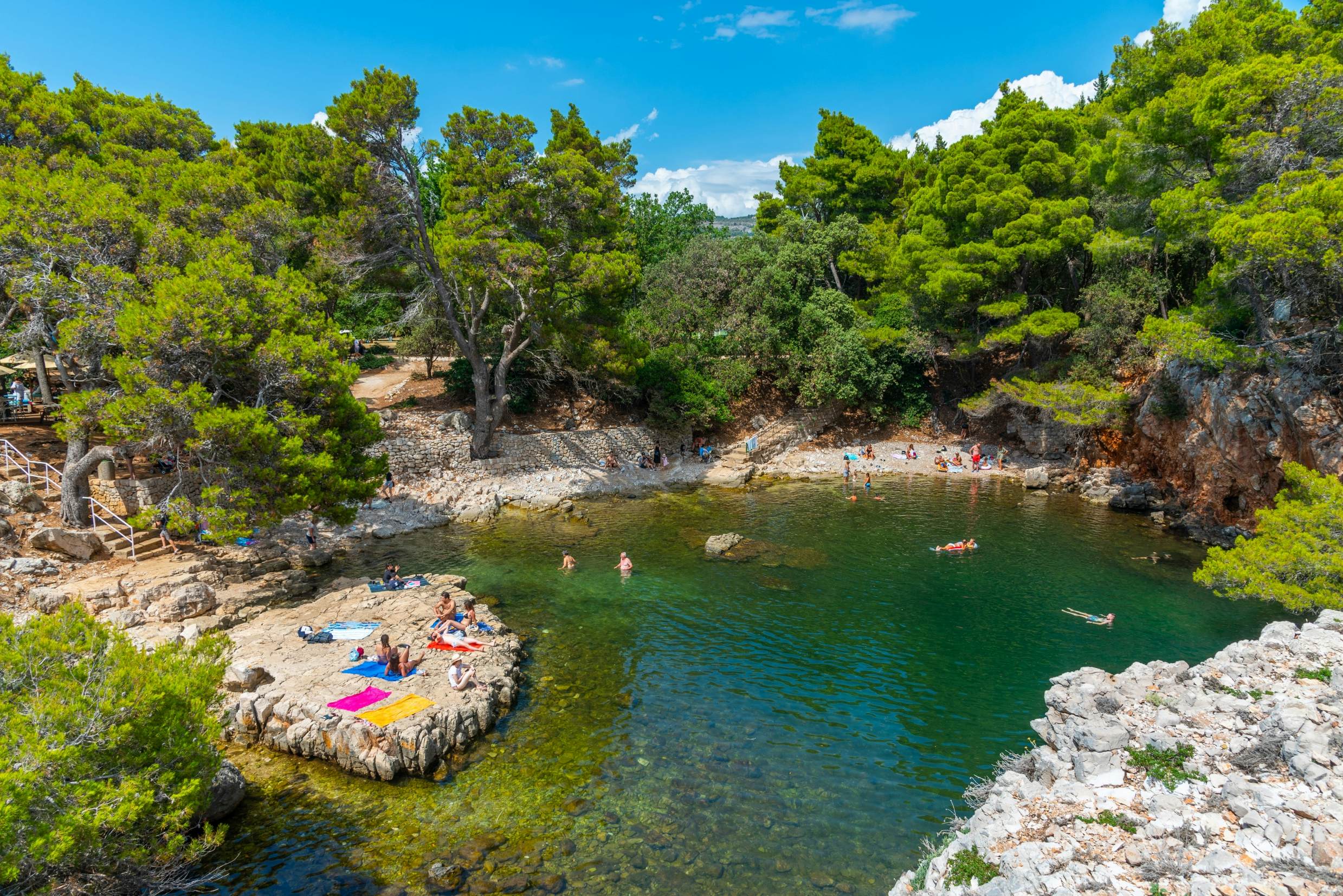 Dubrovnik, Croatia, July 25, 2020: People are swimming at Dead Sea sinkhole at Lokrum island near Dubrovnik, Croatia