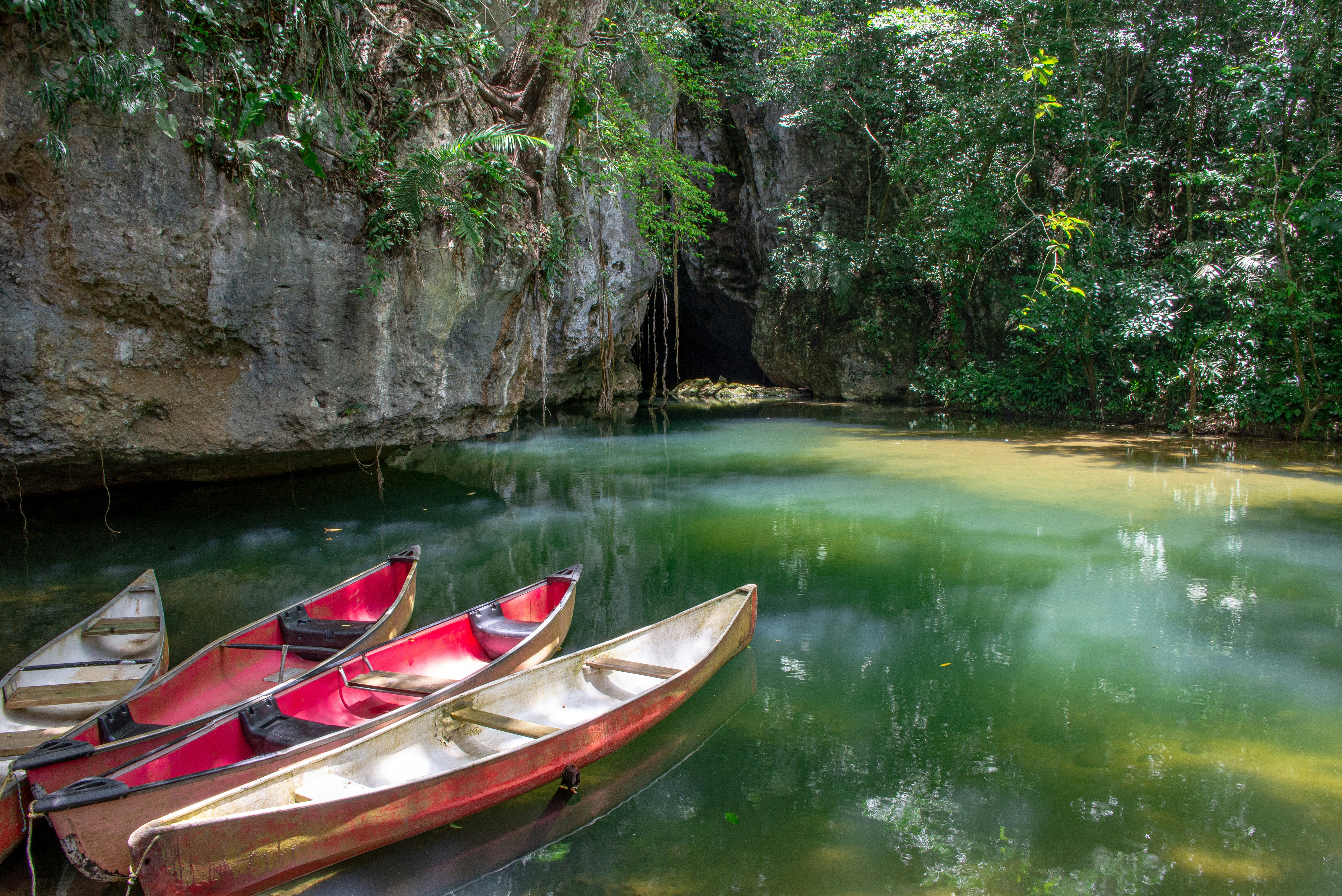 Canoes at the entrance to Barton Creek Cave in the Cayo District of Belize.