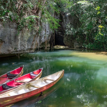 Cayo District, Belize - June 2018: Canoes at the entrance to Barton Creek Cave in the Cayo District of Belize, Central America. The cave, near San Ignacio, is an important Mayan archaeological site. License Type: media Download Time: 2022-09-12T03:36:33.000Z User: hannahblackie10 Is Editorial: Yes purchase_order: