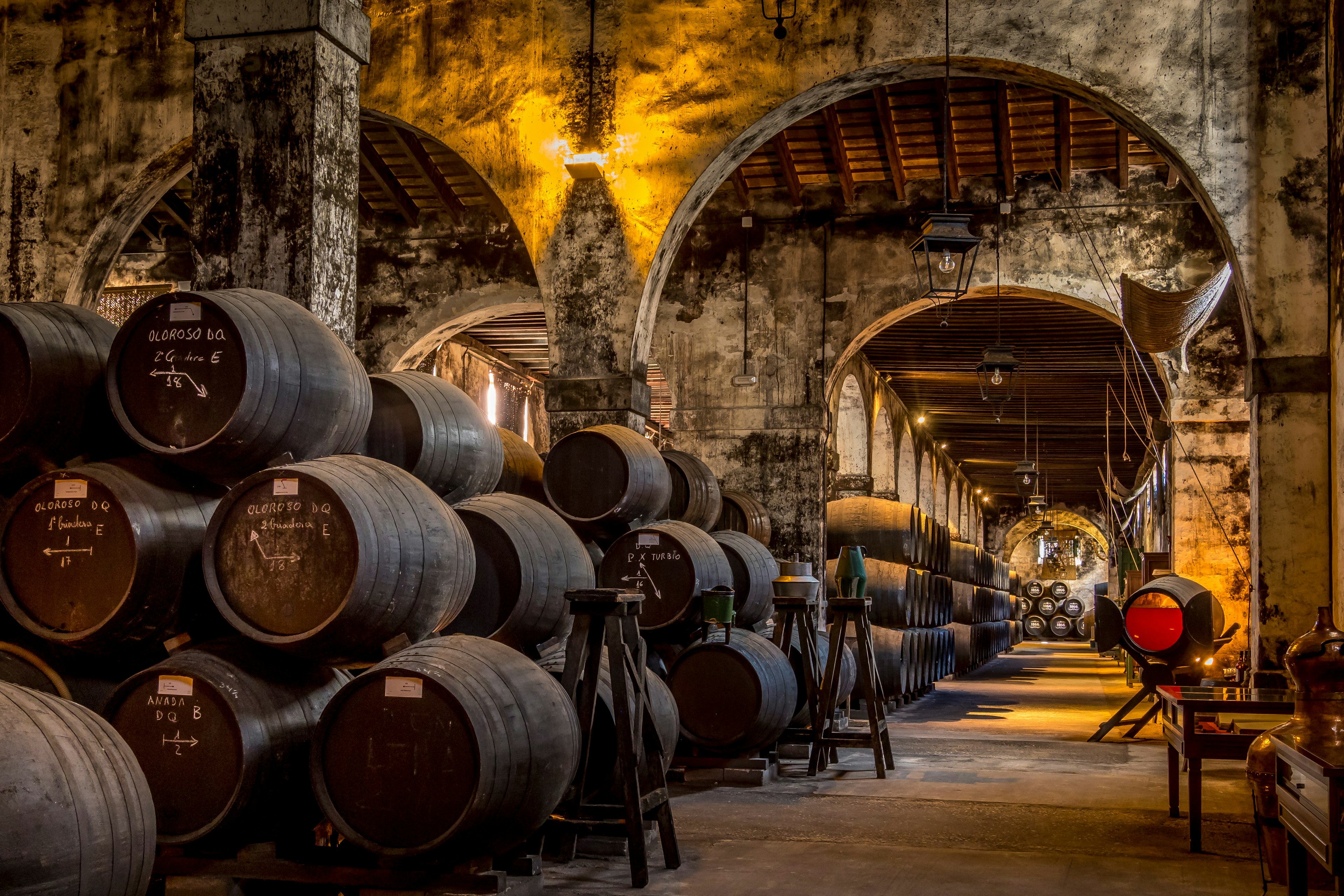 View of sherry barrels inside the famous Bodegas Osborne in El Puerto de Santa Maria, Cadiz, Spain.