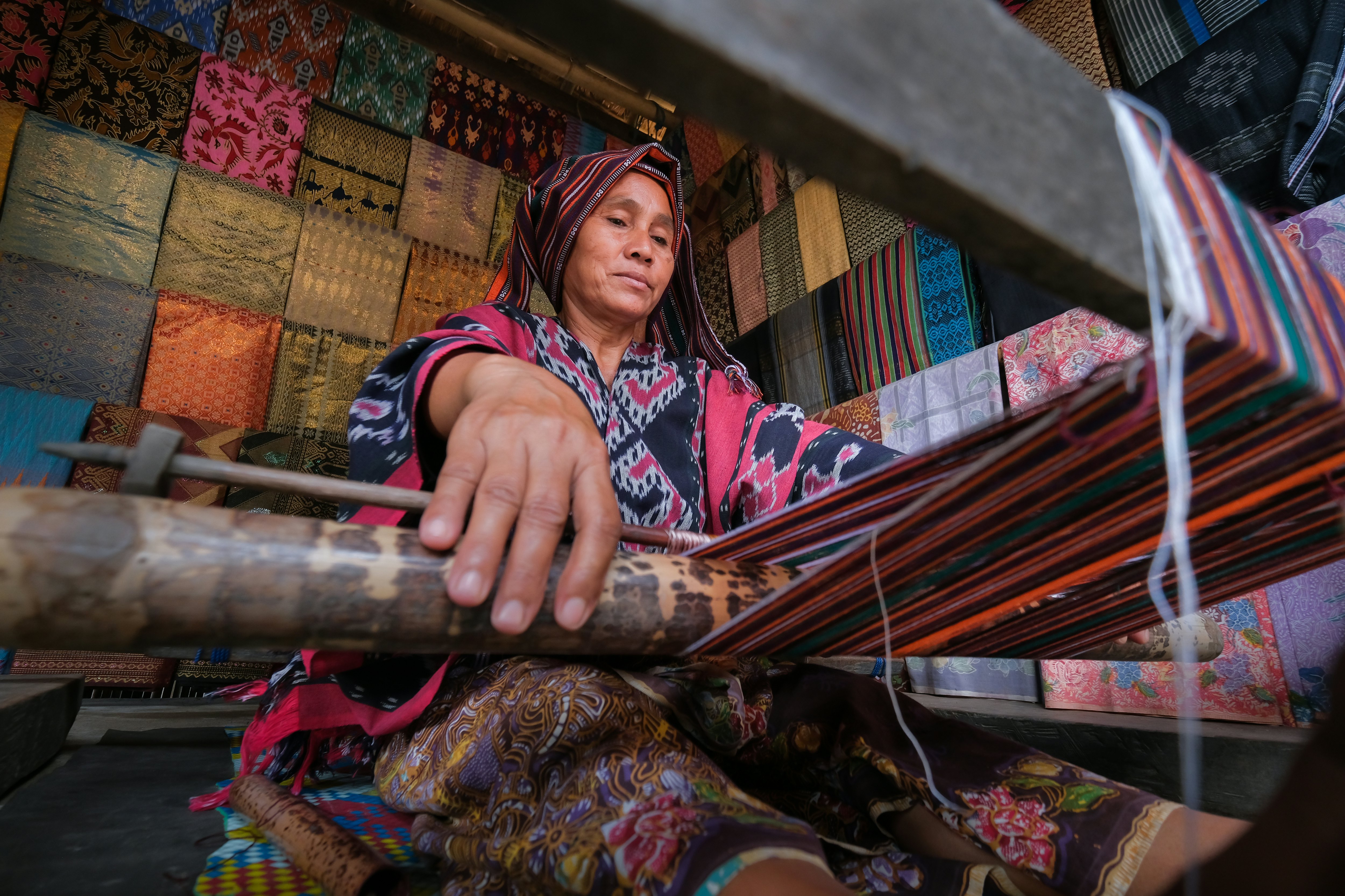 Old Women in Village making traditional hand woven, Ampenan, Lombok