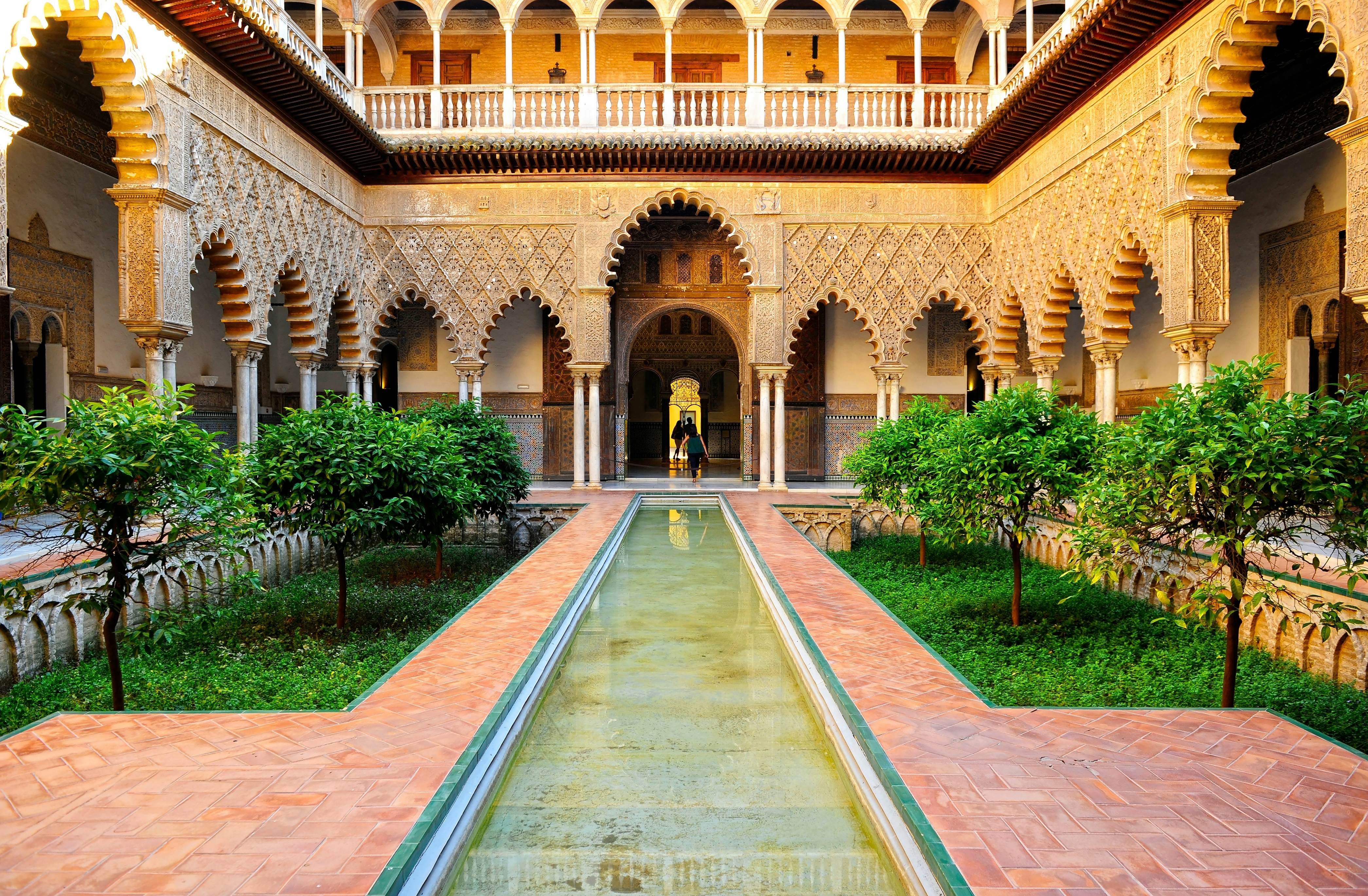 The ornately designed Courtyard of the Maidens in the Mudejar Palace of the Real Alcazar.