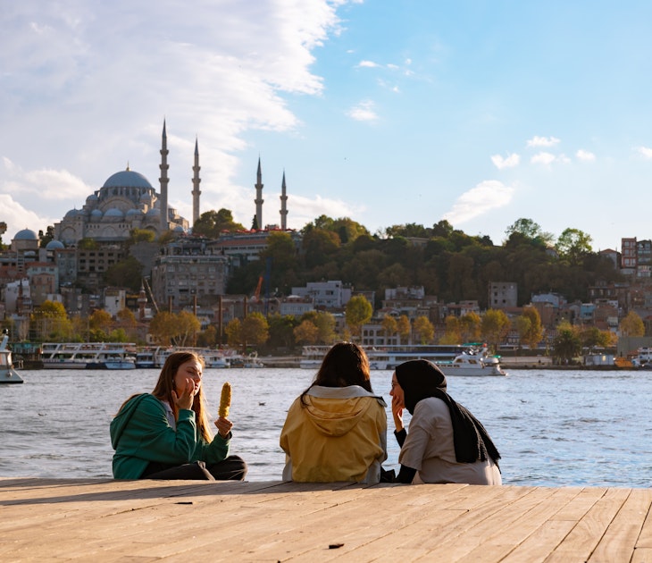 Turkish youth. Hijabi and non-hijabi friends near the Golden Horn in Istanbul. Religios and secular young Turks. Istanbul Turkiye - 10.4.2022, License Type: media, Download Time: 2025-02-13T18:22:21.000Z, User: rhylton_redventures, Editorial: true, purchase_order: 56530 - Guidebooks, job: Lonely Planet WIP, client: Lonely Planet WIP, other: Rhianydd Hylton