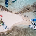 Aerial photo of tour boats anchored off South Silk Caye in the Gladden Spit and Silk Cayes Marine Reserve in Belize on March 12, 2023, License Type: media, Download Time: 2025-01-27T19:51:40.000Z, User: Ppeterson948, Editorial: true, purchase_order: 56530 - Guidebooks, job: Global Publishing WIP, client: Global Publishing WIP, other: Pia Peterson Haggarty