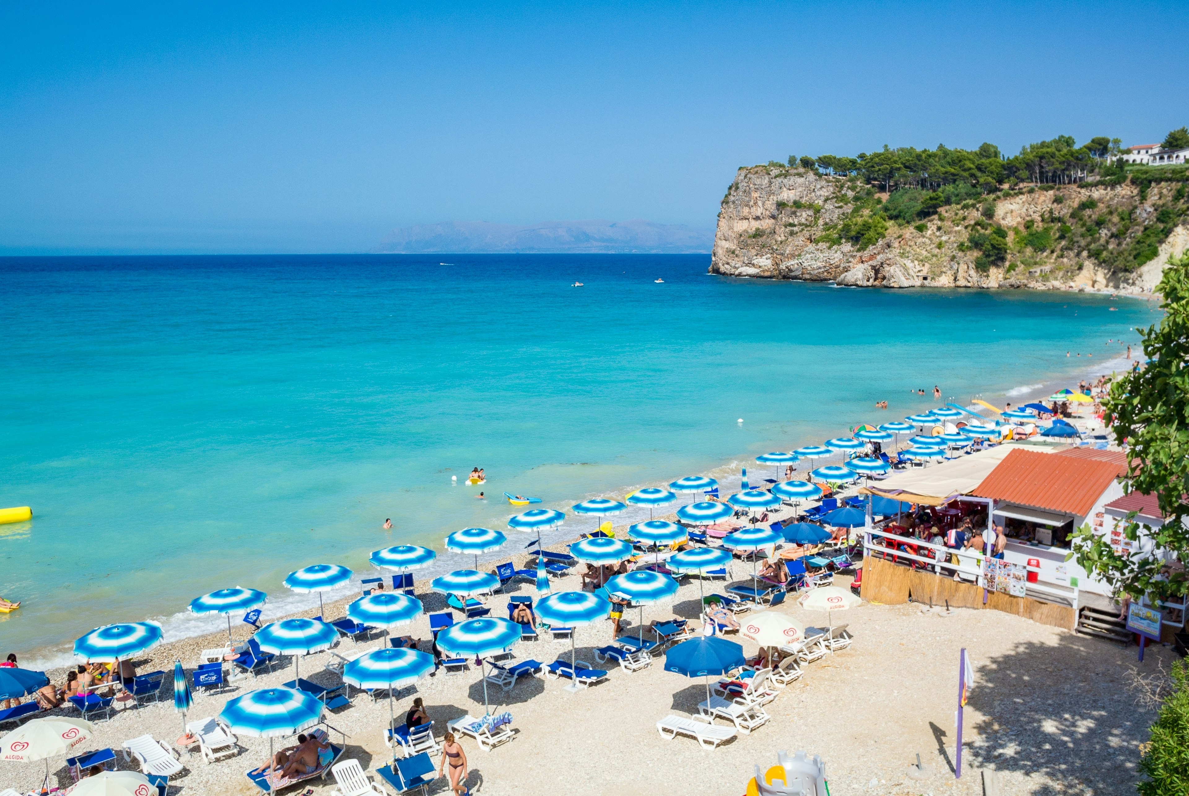 Umbrellas line the beach in Trapani.