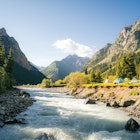 River and tent houses with yurt in the mountain valley of Altyn Arashan gorge, Kyrgyzstan. Morning vibes. Sun rays. Sunrise, License Type: media, Download Time: 2025-01-30T21:59:16.000Z, User: katelyn.perry_lonelyplanet, Editorial: false, purchase_order: 65050 - Digital Destinations and Articles, job: Lonely Planet WiP, client: Lonely Planet WiP, other: Katelyn Perry