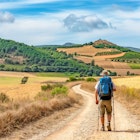 Lonely Pilgrim with backpack walking the Camino de Santiago in Spain, Way of St James, License Type: media, Download Time: 2024-10-03T16:42:41.000Z, User: Eointloughney87, Editorial: false, purchase_order: 56530, job: Global Publishing-WIP, client: Best Road Trips Spain & Portugal 3, other: Eoin T Loughney