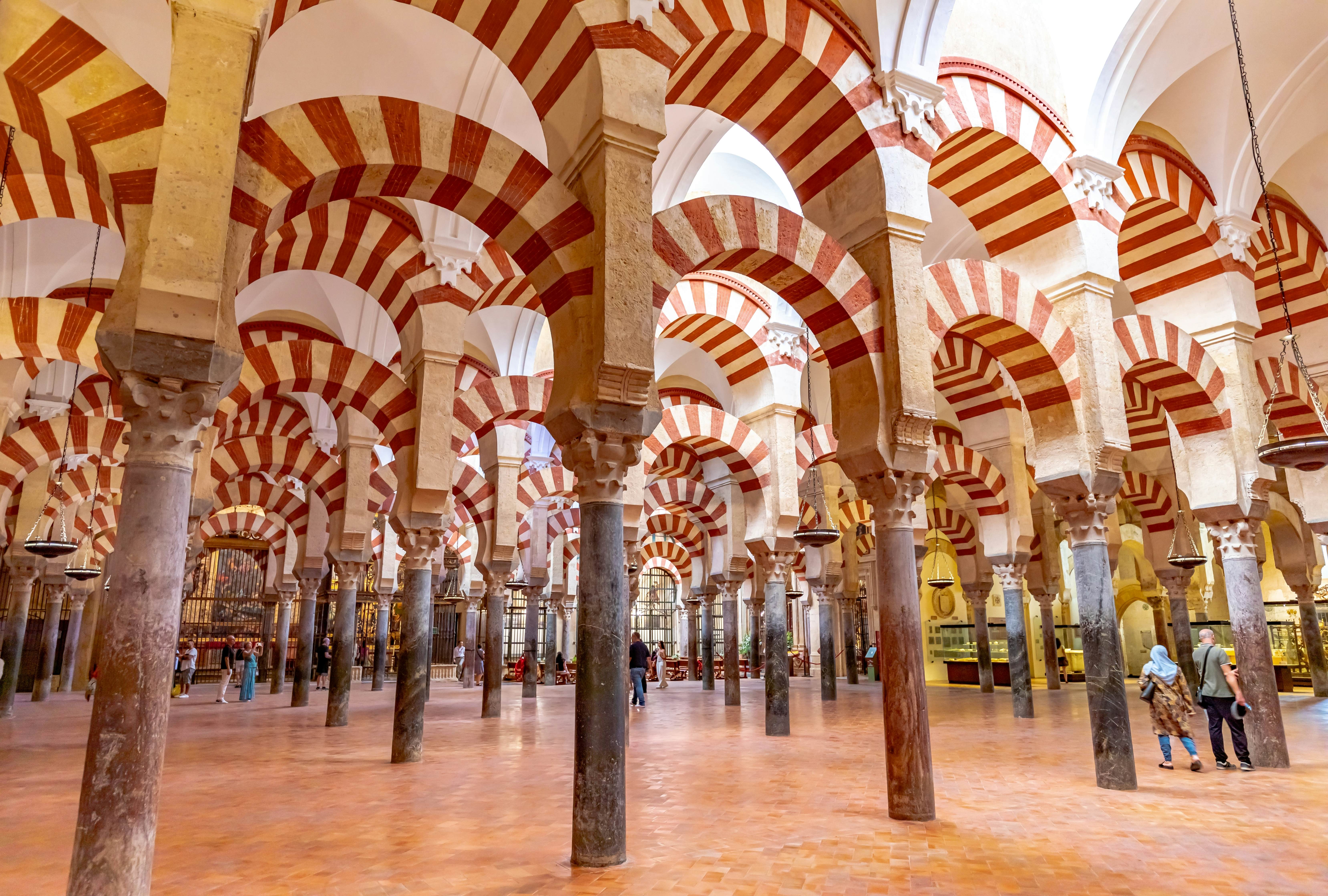 Red-and-white striped arches and columns in a former Moorish mosque.