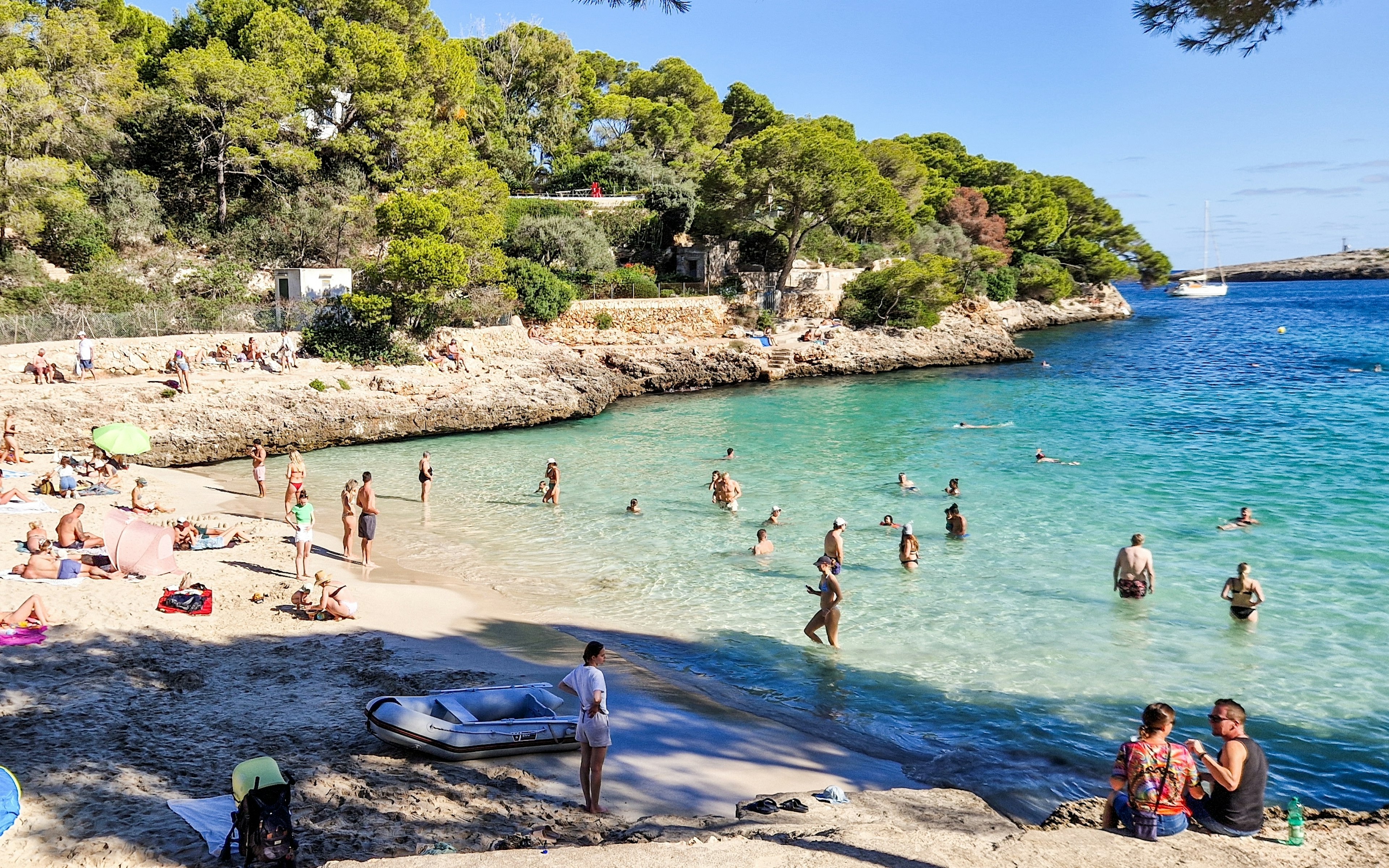 People enjoying the beach on the island of Mallorca, Spain.