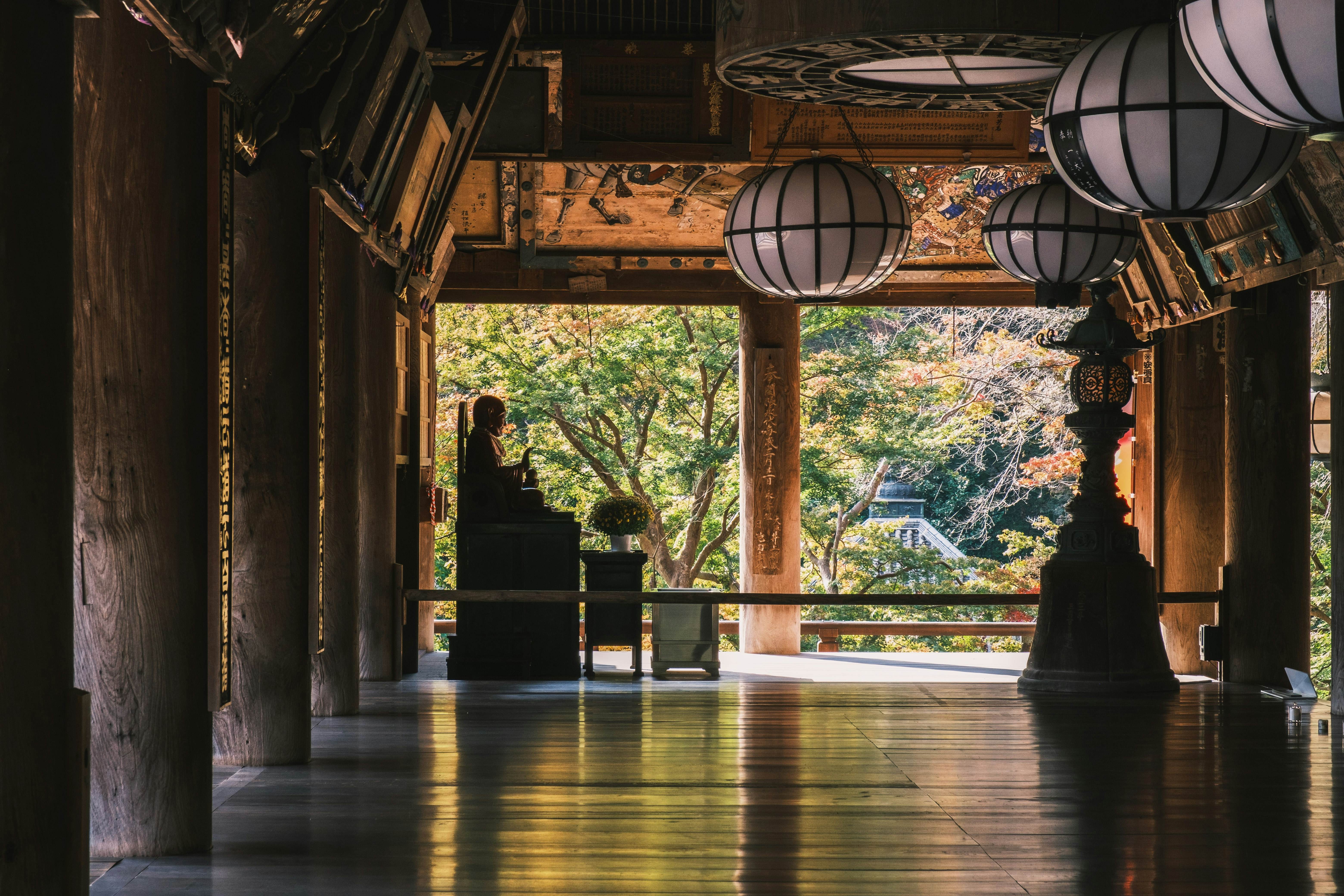 NARA, JAPAN - November 5, 2021 A historic temple in Nara with beautiful autumn foliage, A nostalgic space with a Buddha statue standing in the back, Hasedera Temple, License Type: media, Download Time: 2025-02-20T21:52:43.000Z, User: katelyn.perry_lonelyplanet, Editorial: true, purchase_order: 65050 - Digital Destinations and Articles, job: wip, client: wip, other: Katelyn Perry