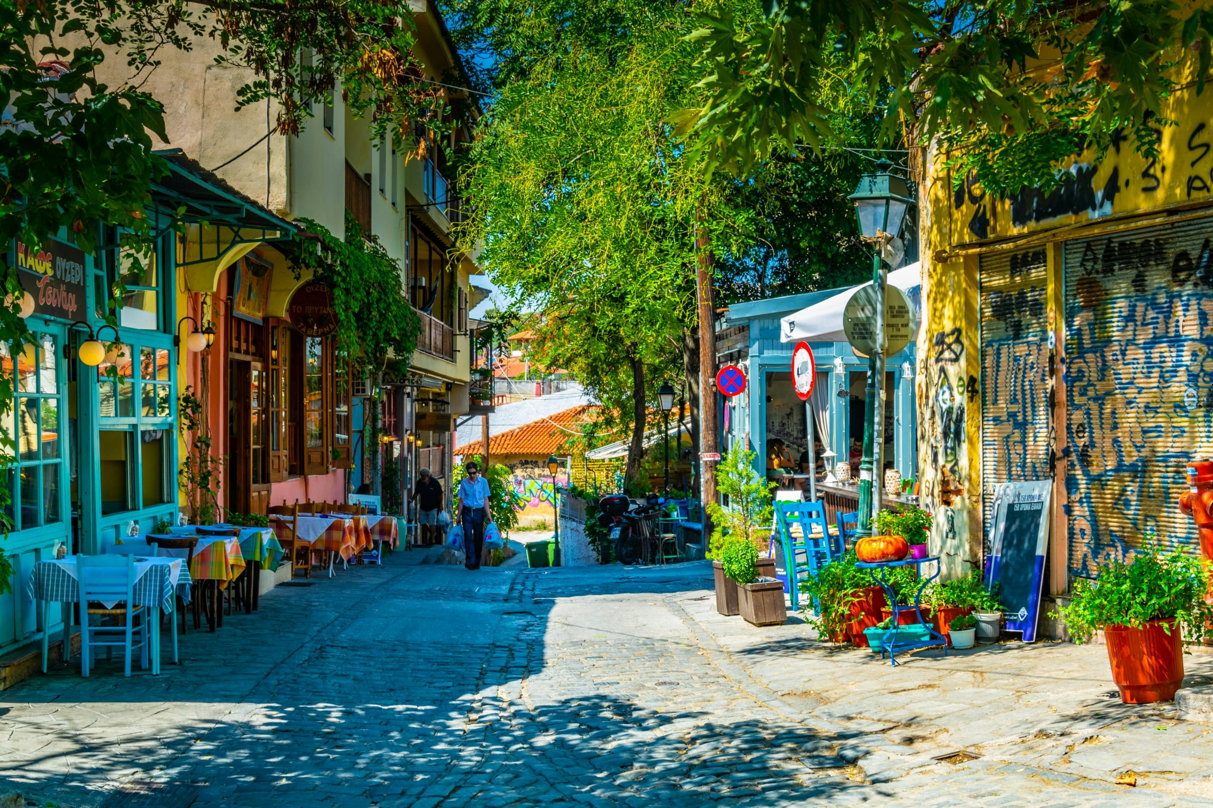 A narrow street with cafes in the old town of Thessaloniki.