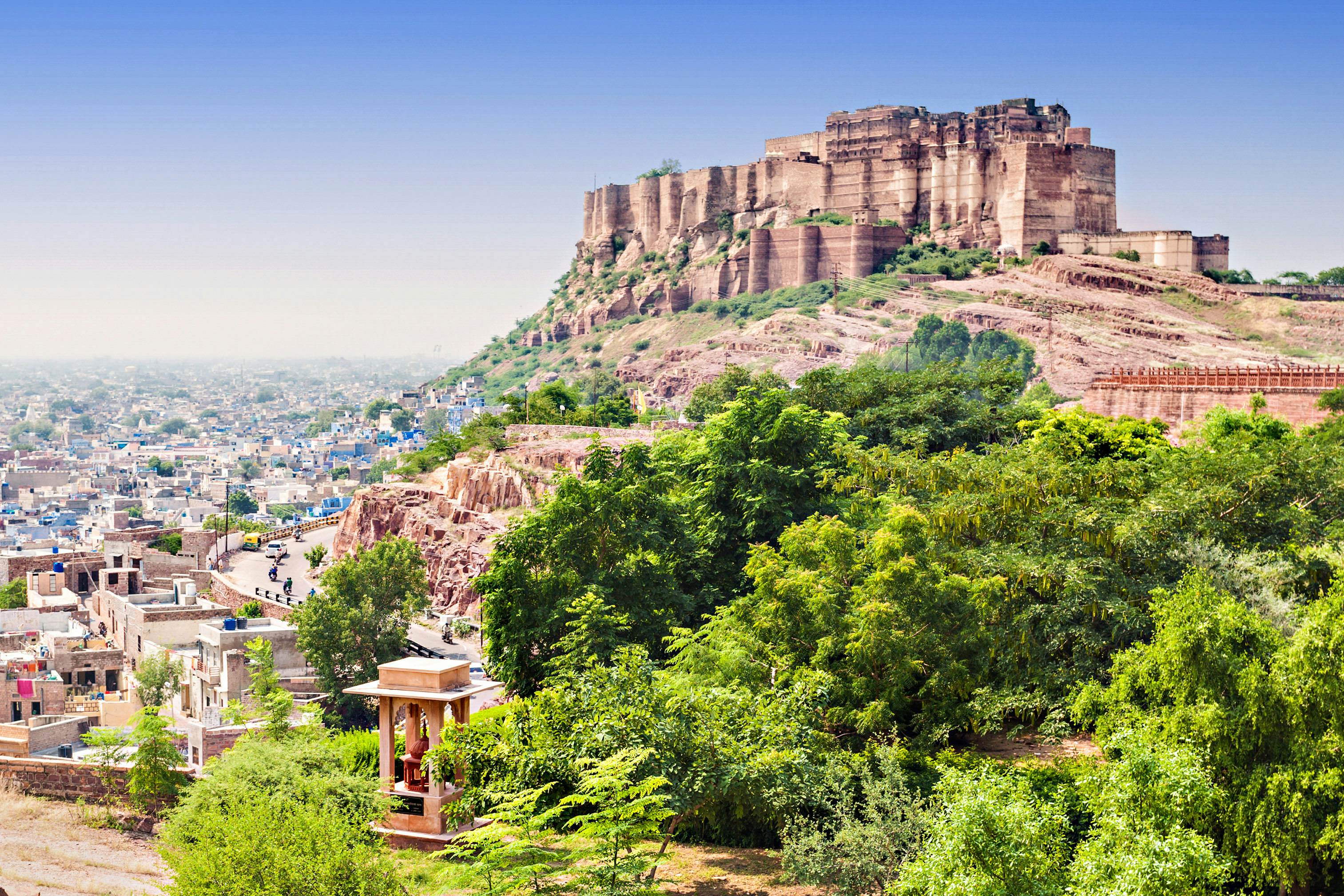 A huge hilltop fortress looming over a city