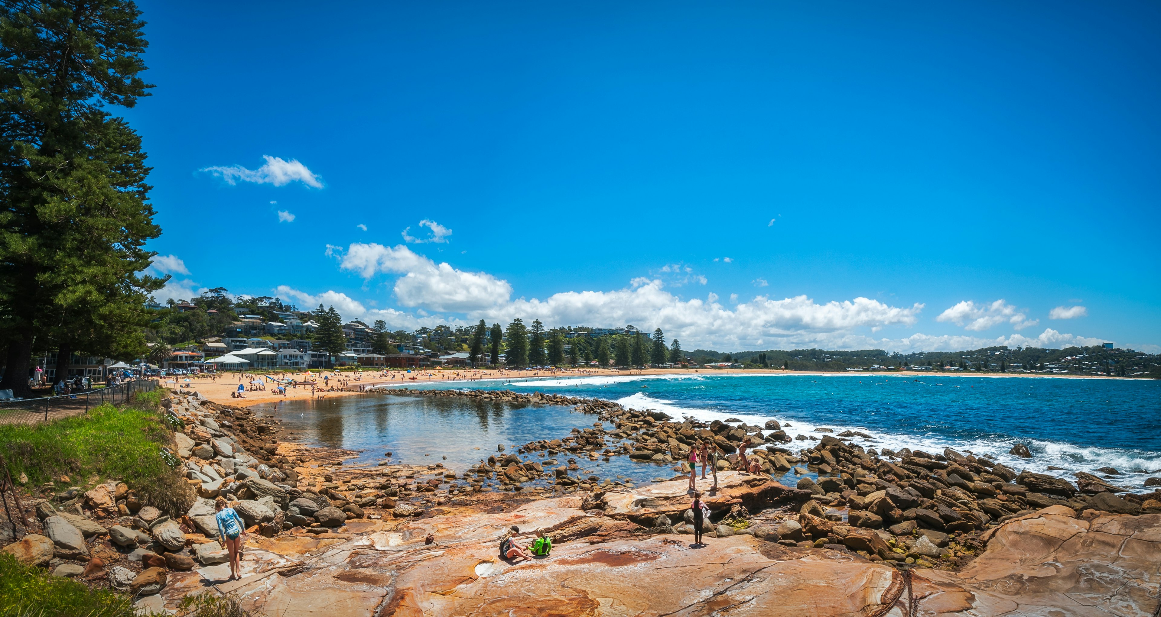 Families enjoy a sunny day at Avoca Beach