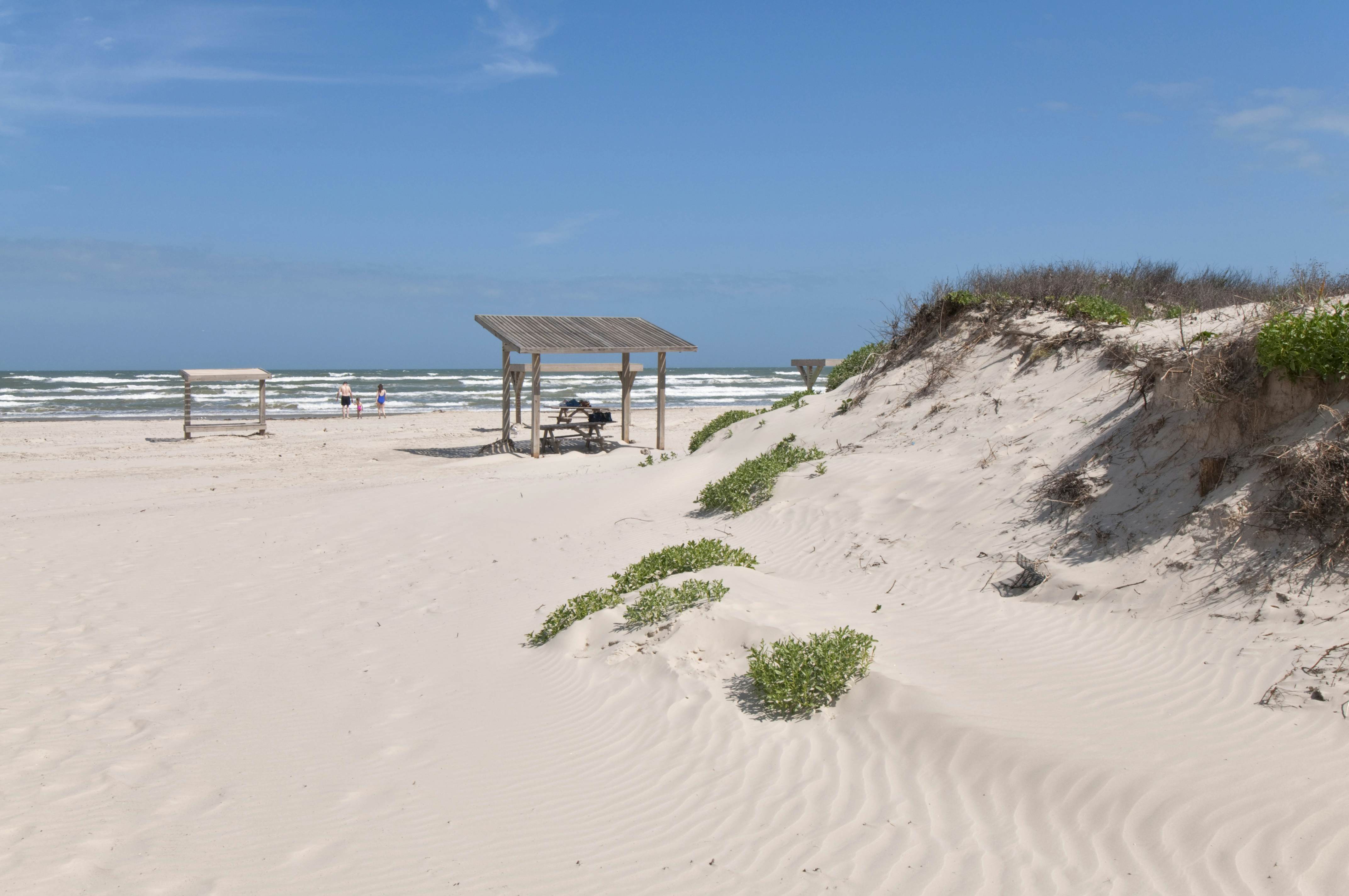 Family consisting of mother, father and female child at Malaquite Beach, Padre Island National Seashore.