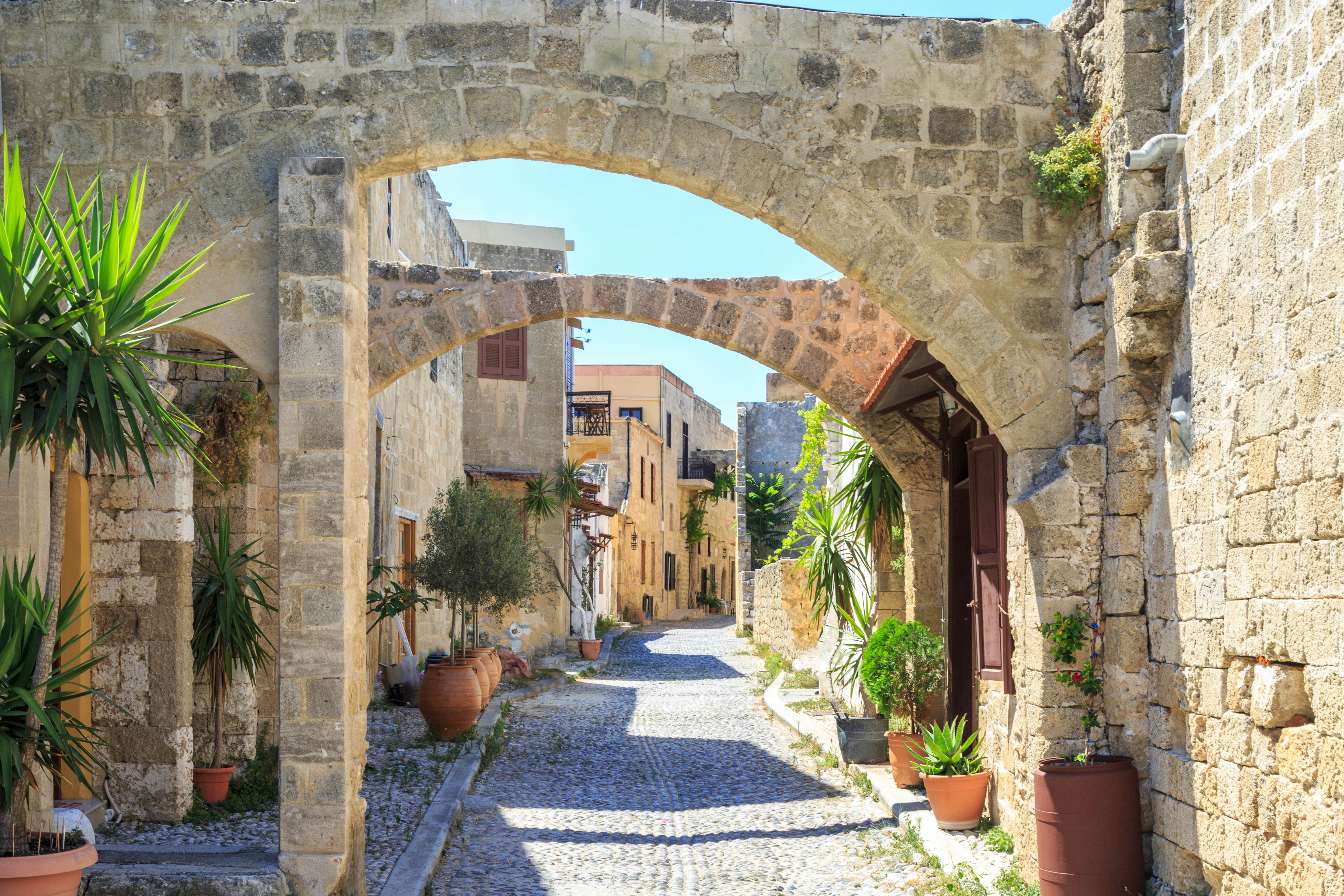 Archways over a street in the old town of Rhodes, Greece