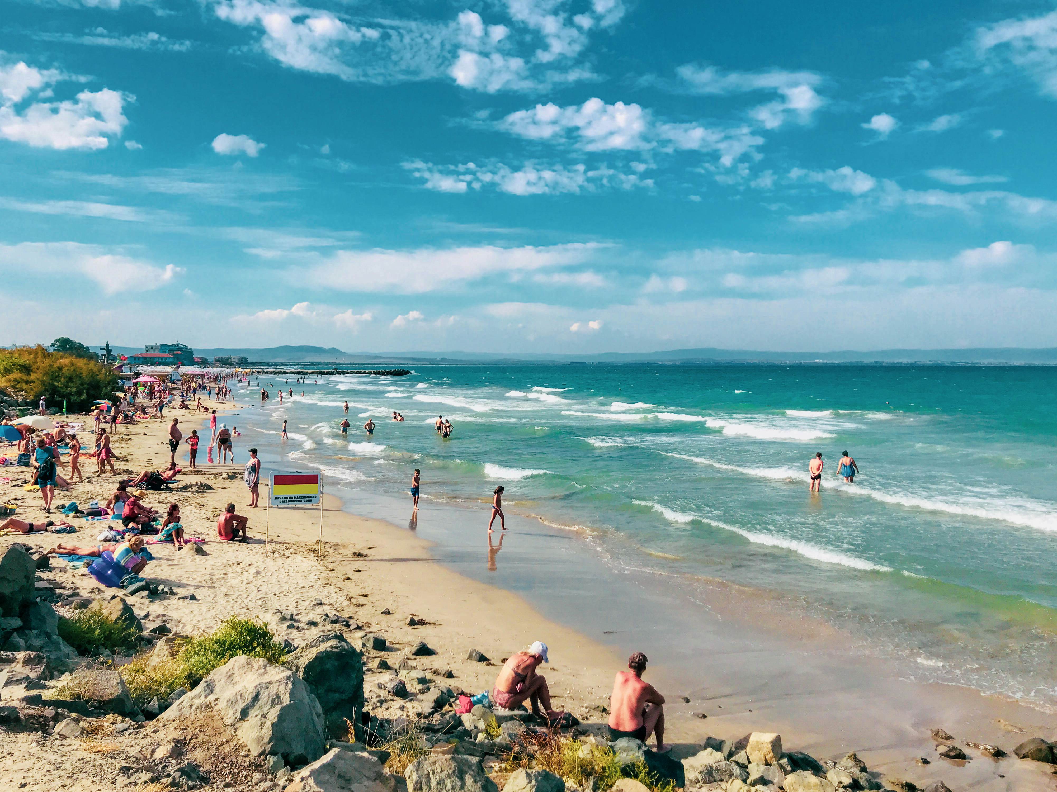 People relaxing on the beach in Pomorie, Bulgaria.