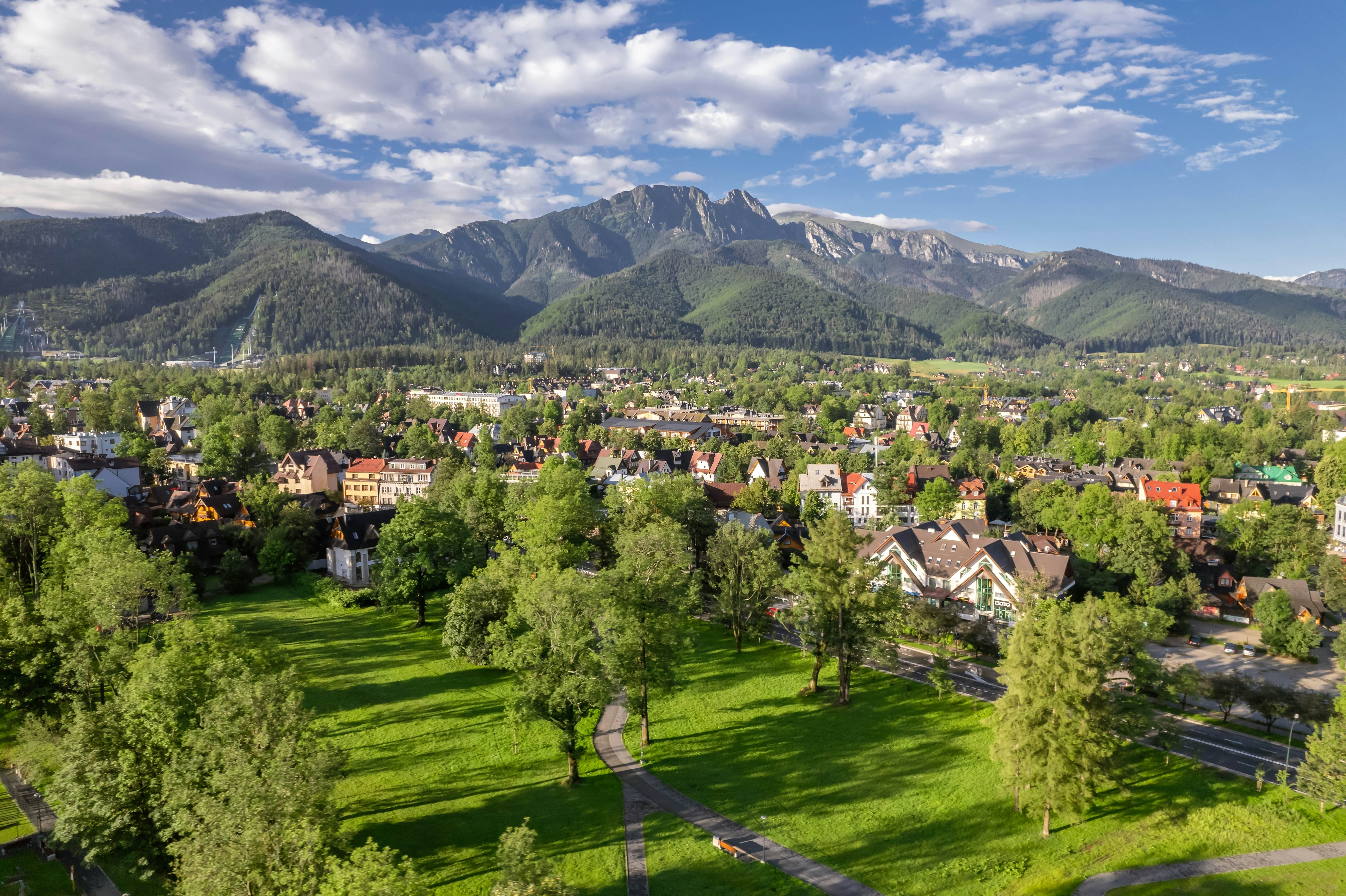 View of Zakopane town with the Tatra Mountains in the background in summer, Poland.