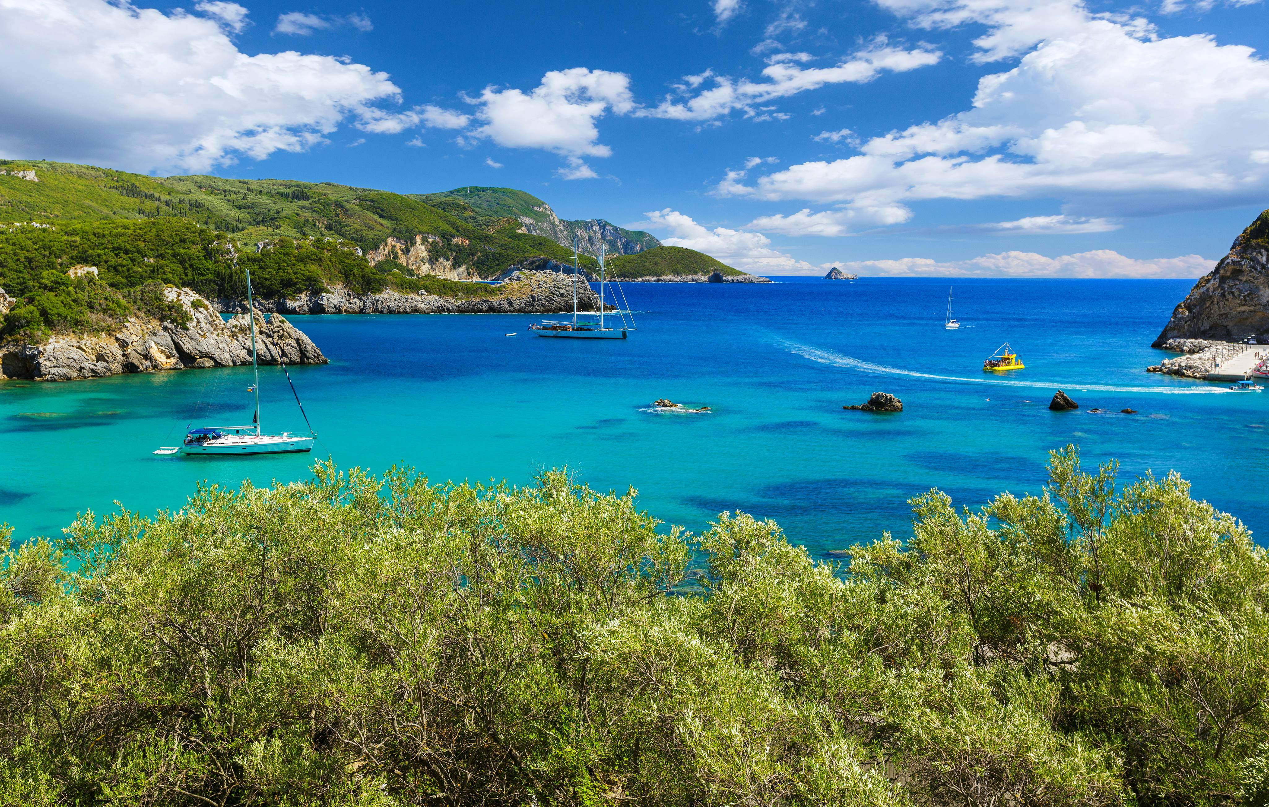 Boats in a cove in Paleokastritsa in Corfu, Greece