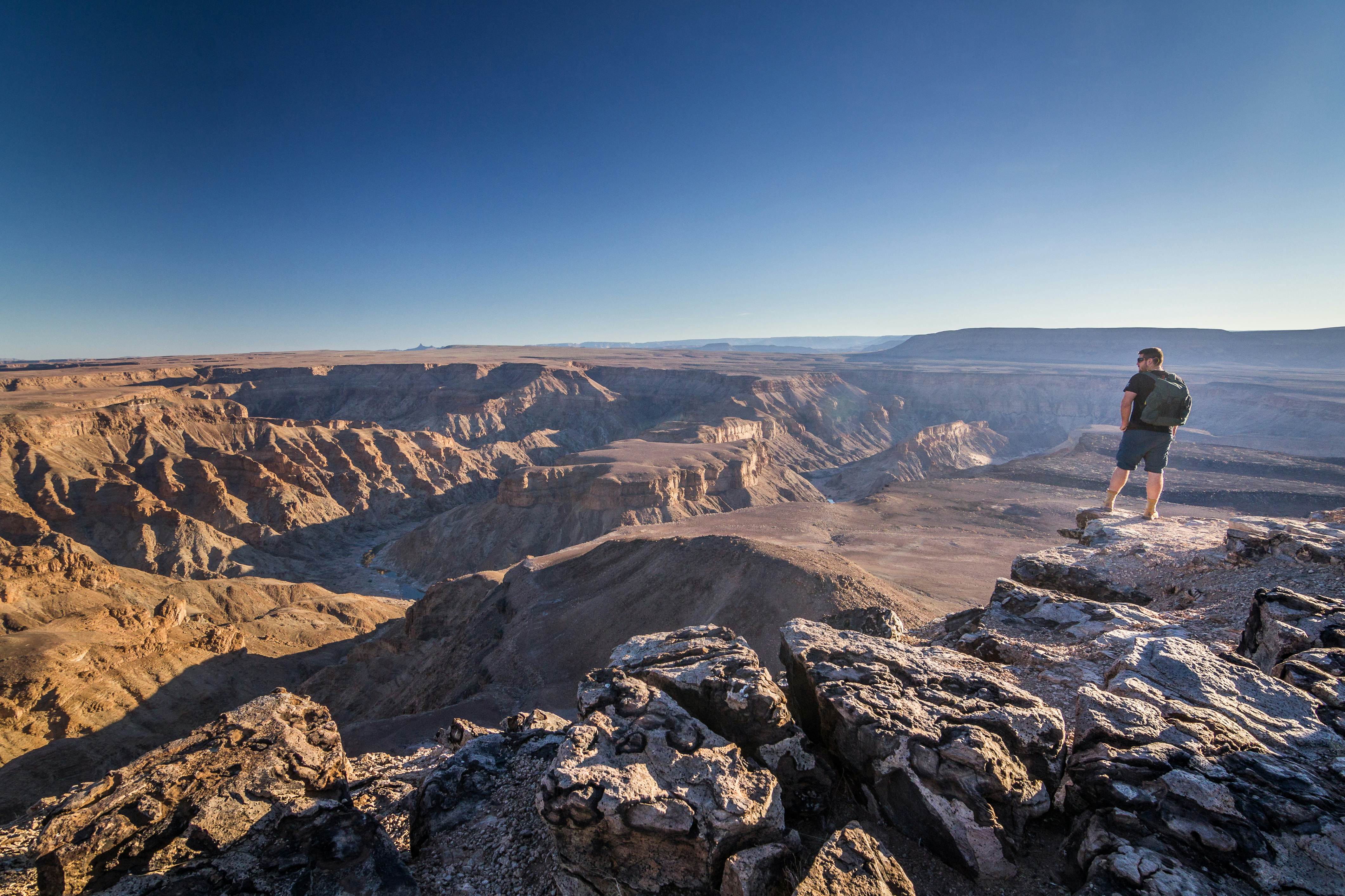 traveller looking to the Fish River Canyon from the viewpont near to Hobas