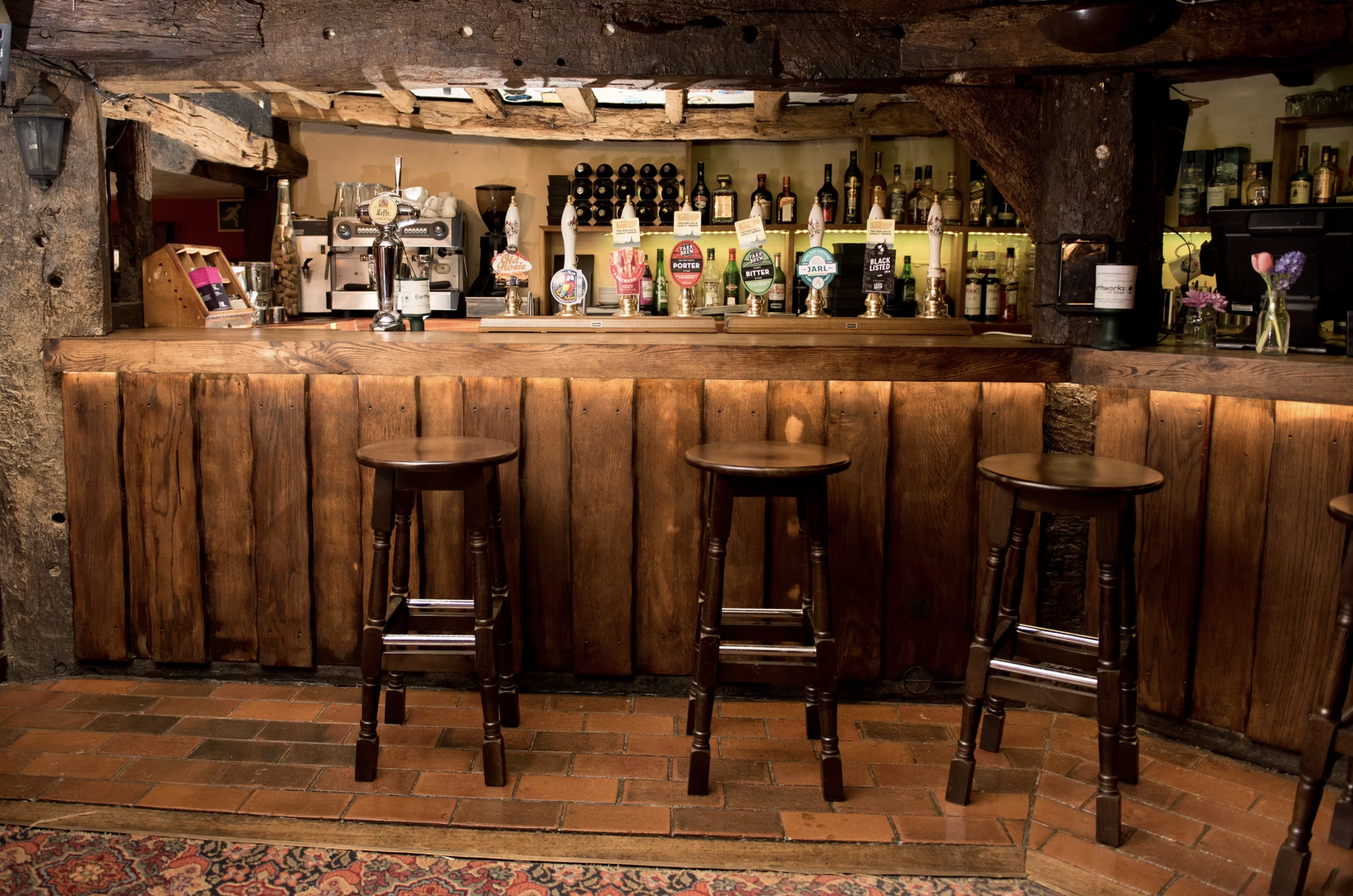 Bar with stools at Ye Olde Fighting Cocks Pub in Saint Albans, UK