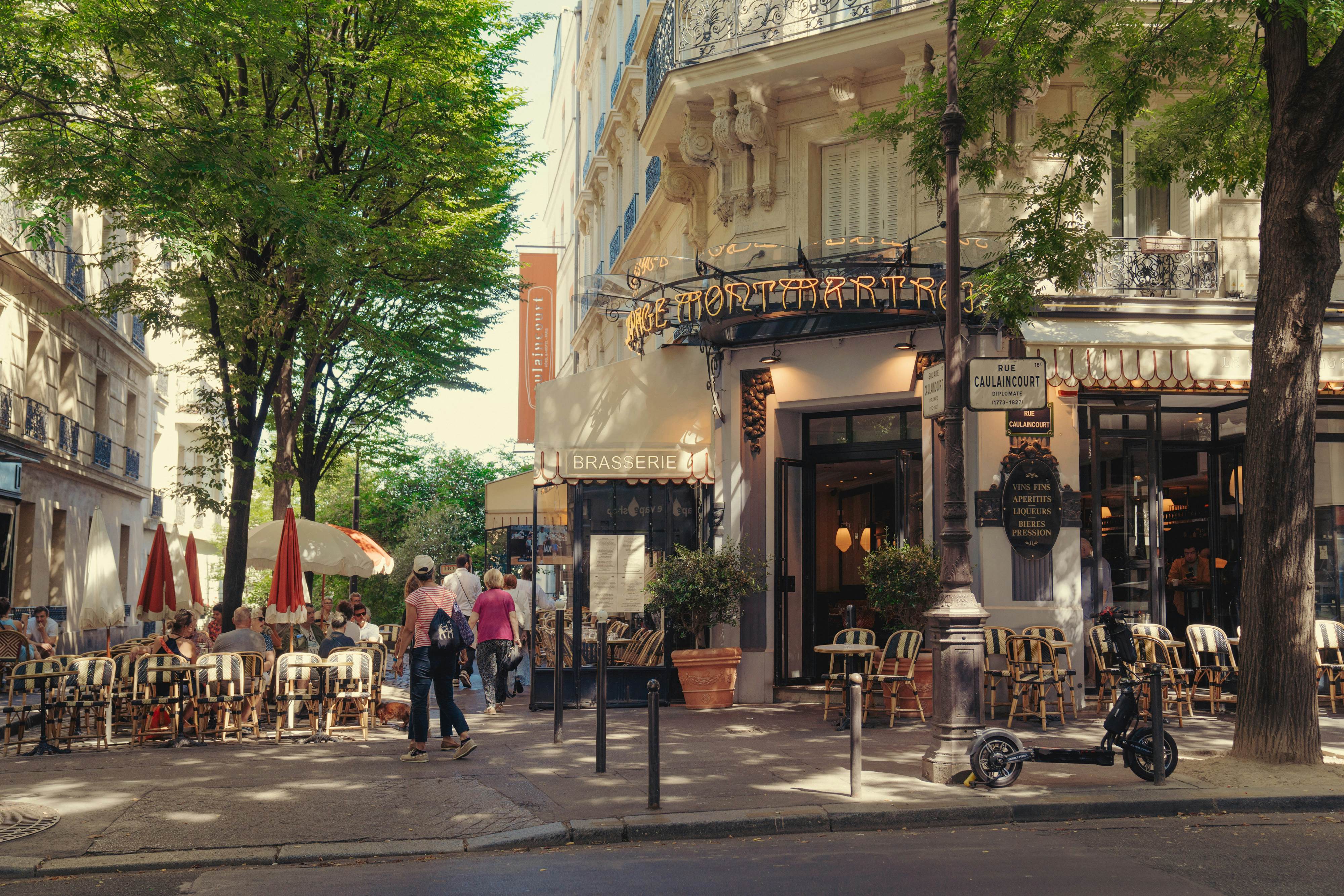 Customers seated outdoors at a typical Parisisan bistro