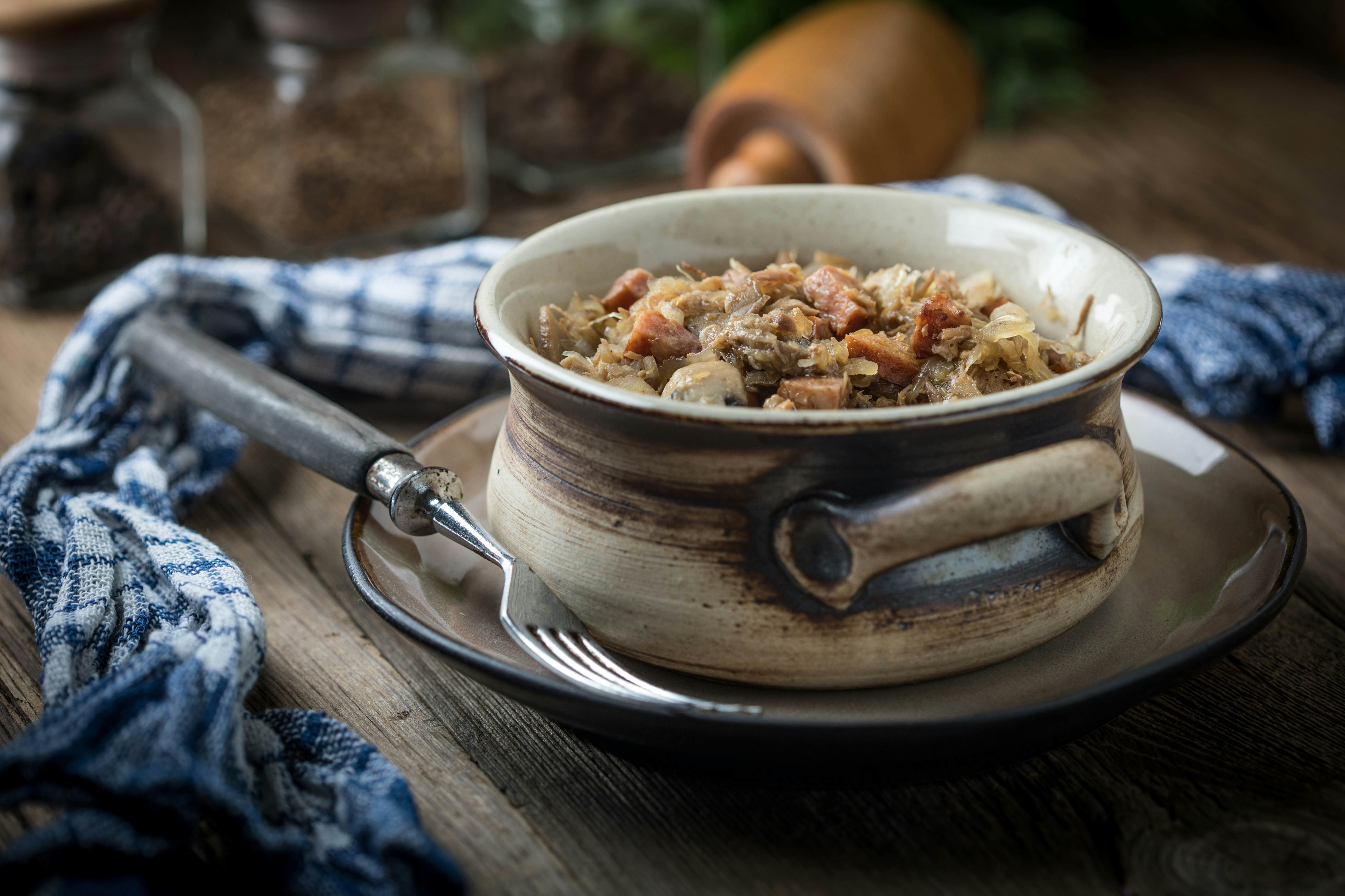 Traditional Polish bigos stew with mushrooms and meat, Poland.