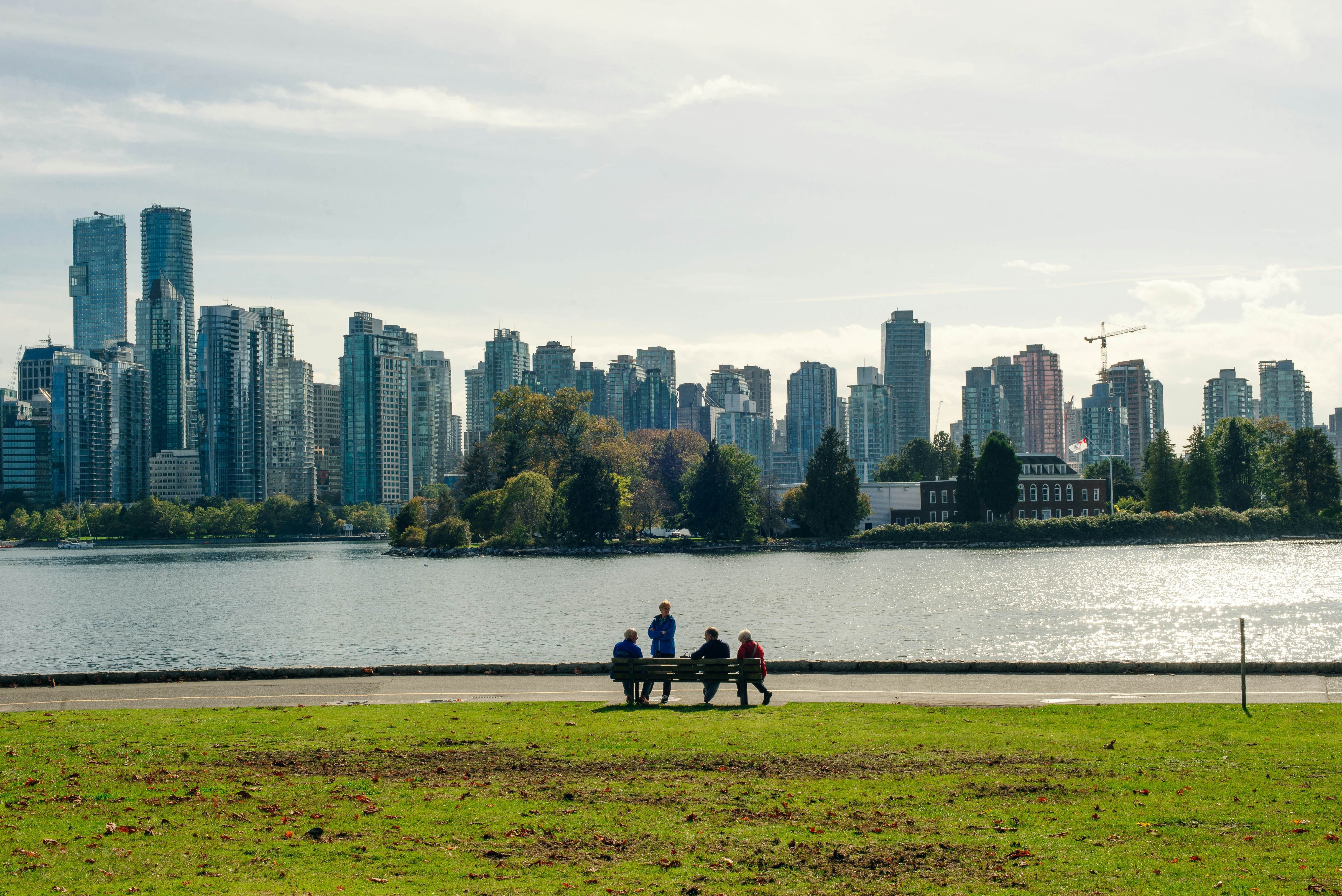 view of Vancouver skyline and Burrard Inlet from Stanley Park in autumn, Vancouver, British Columbia