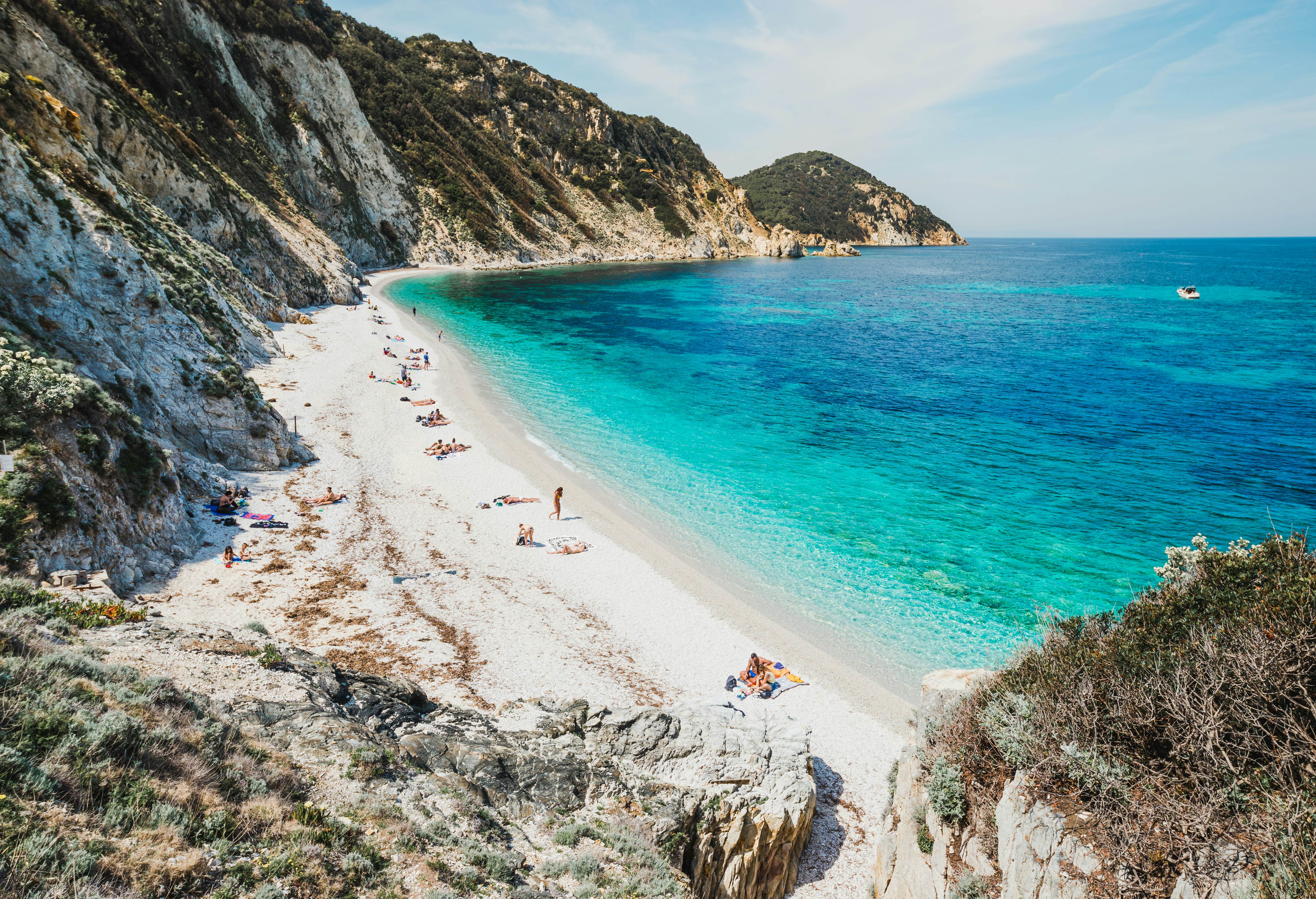 A view of a beautiful bay with emerald water and white sand on the island of Elba, Italy.