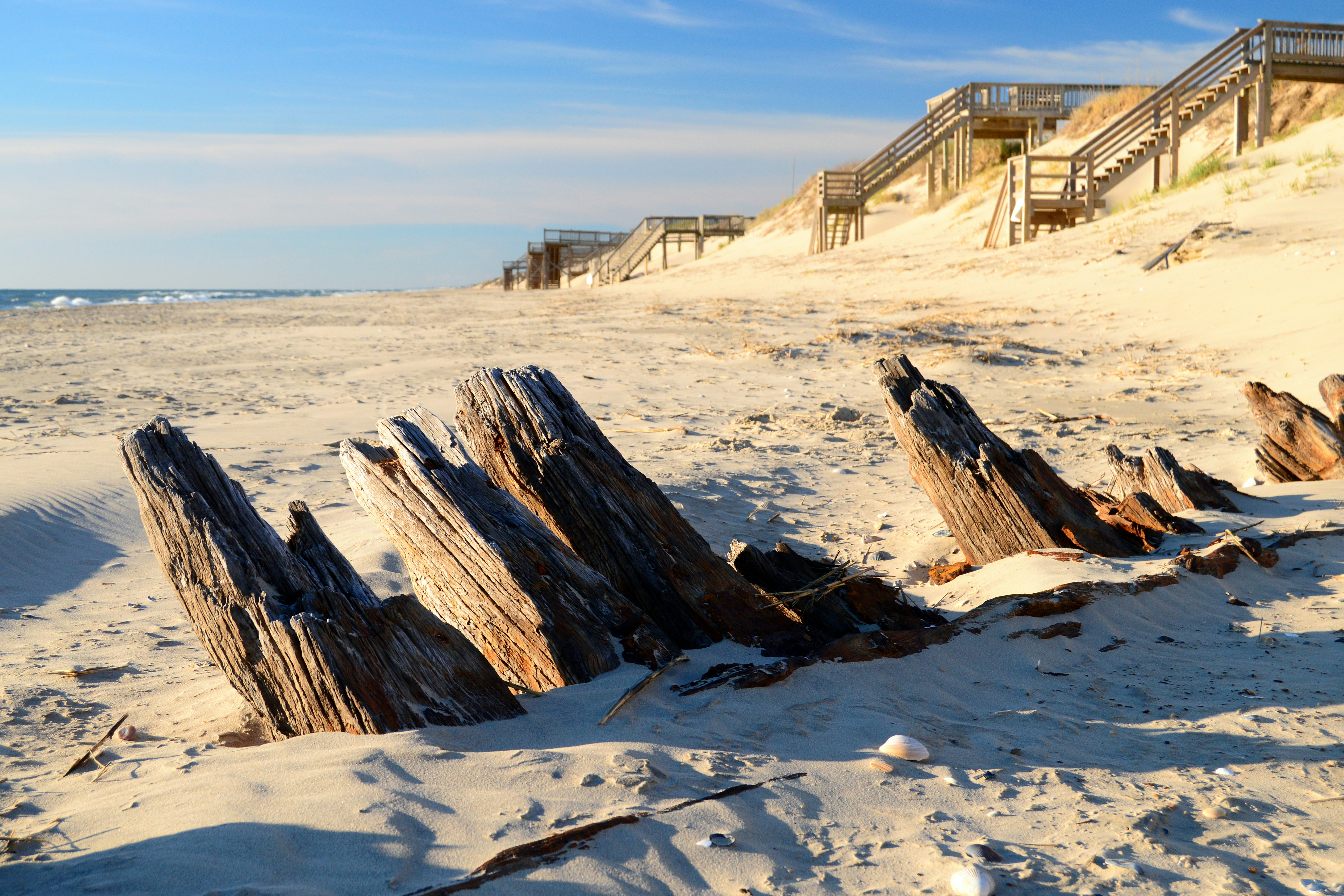The remains of a historic shipwreck poke through the sands along the Outer Banks of North Carolina