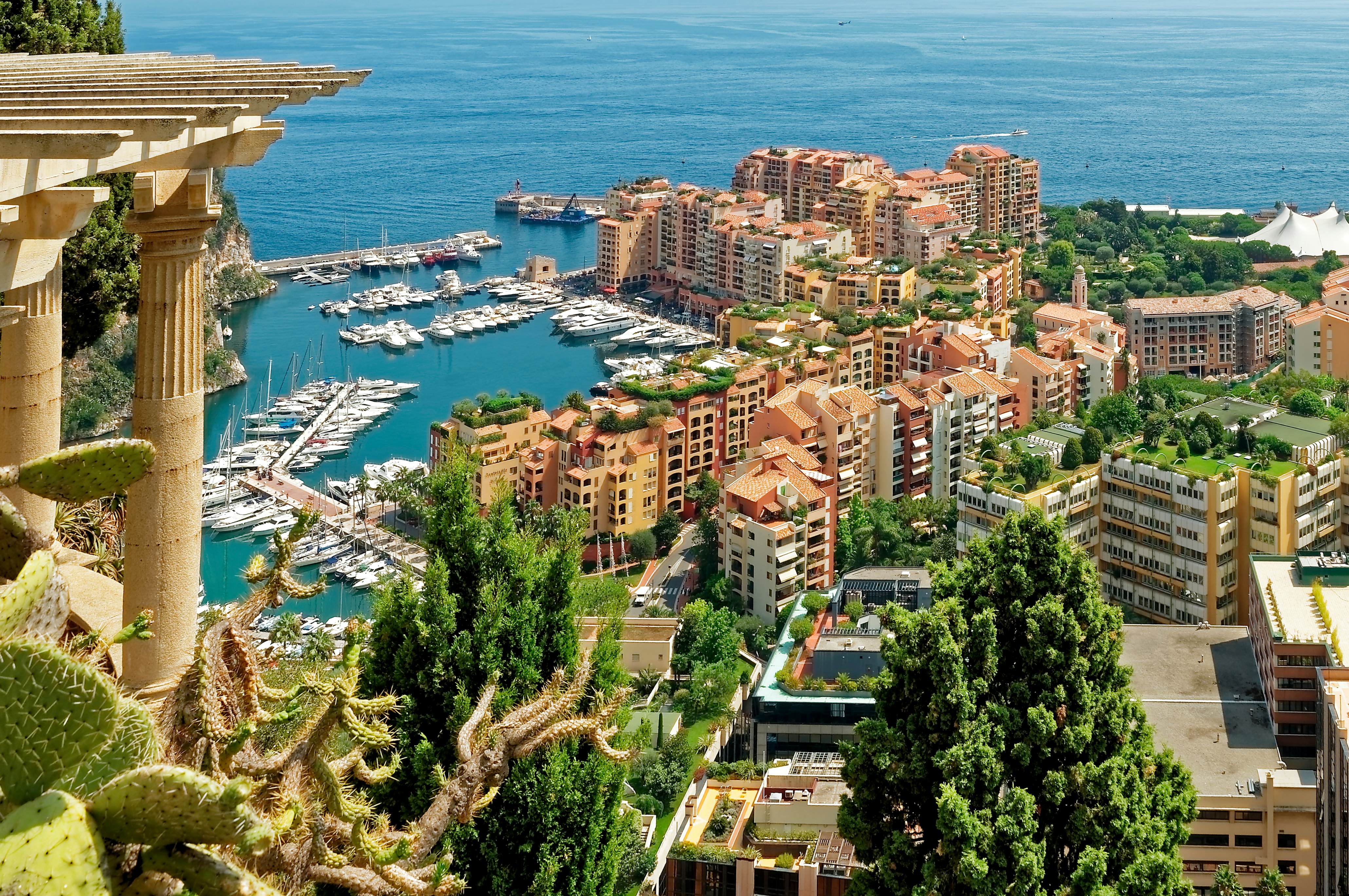 Aerial view of Monaco with apartments and boats in a marina