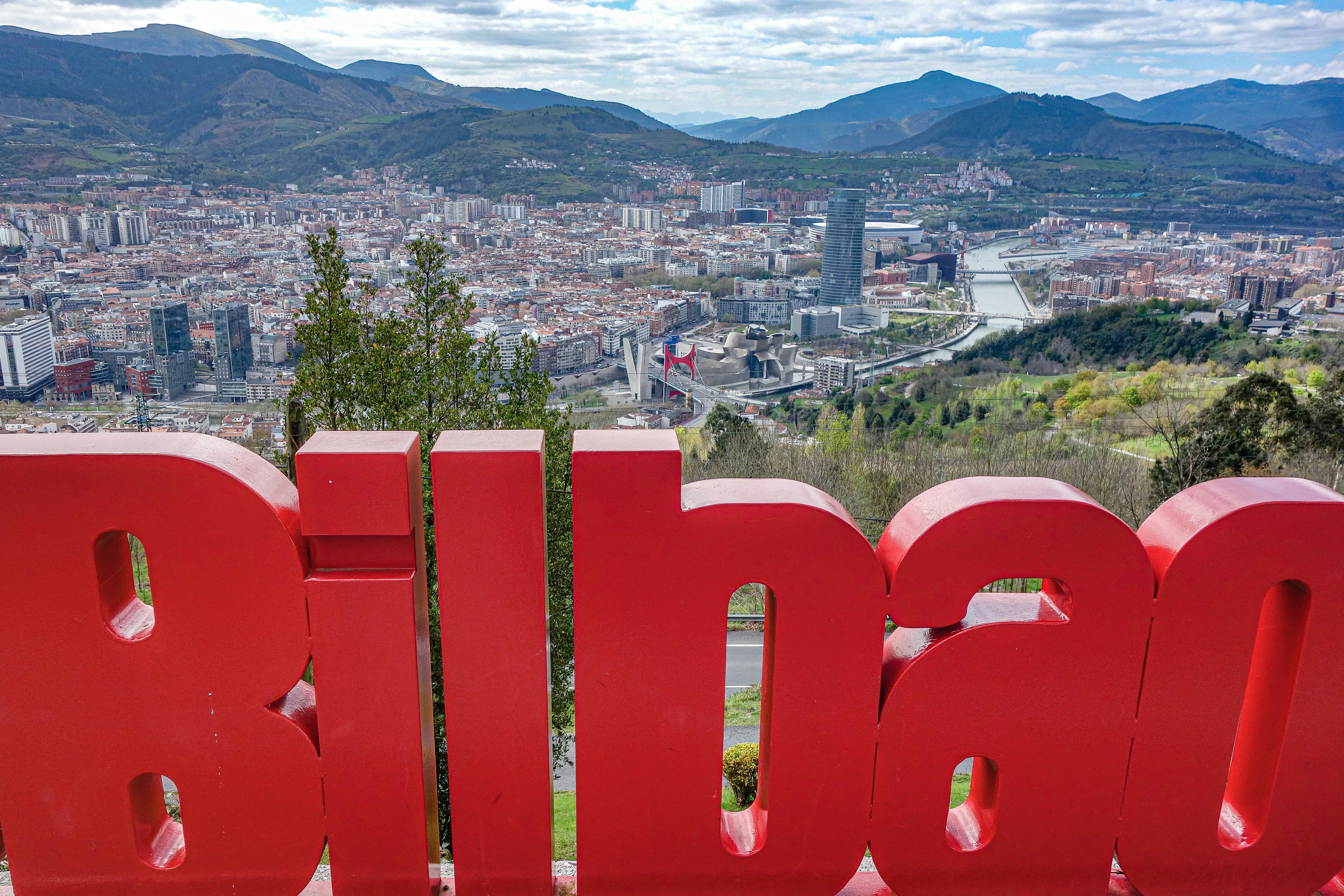 Views across the city of Bilbao from Mirador de Artxanda with a large sign of Bilbao