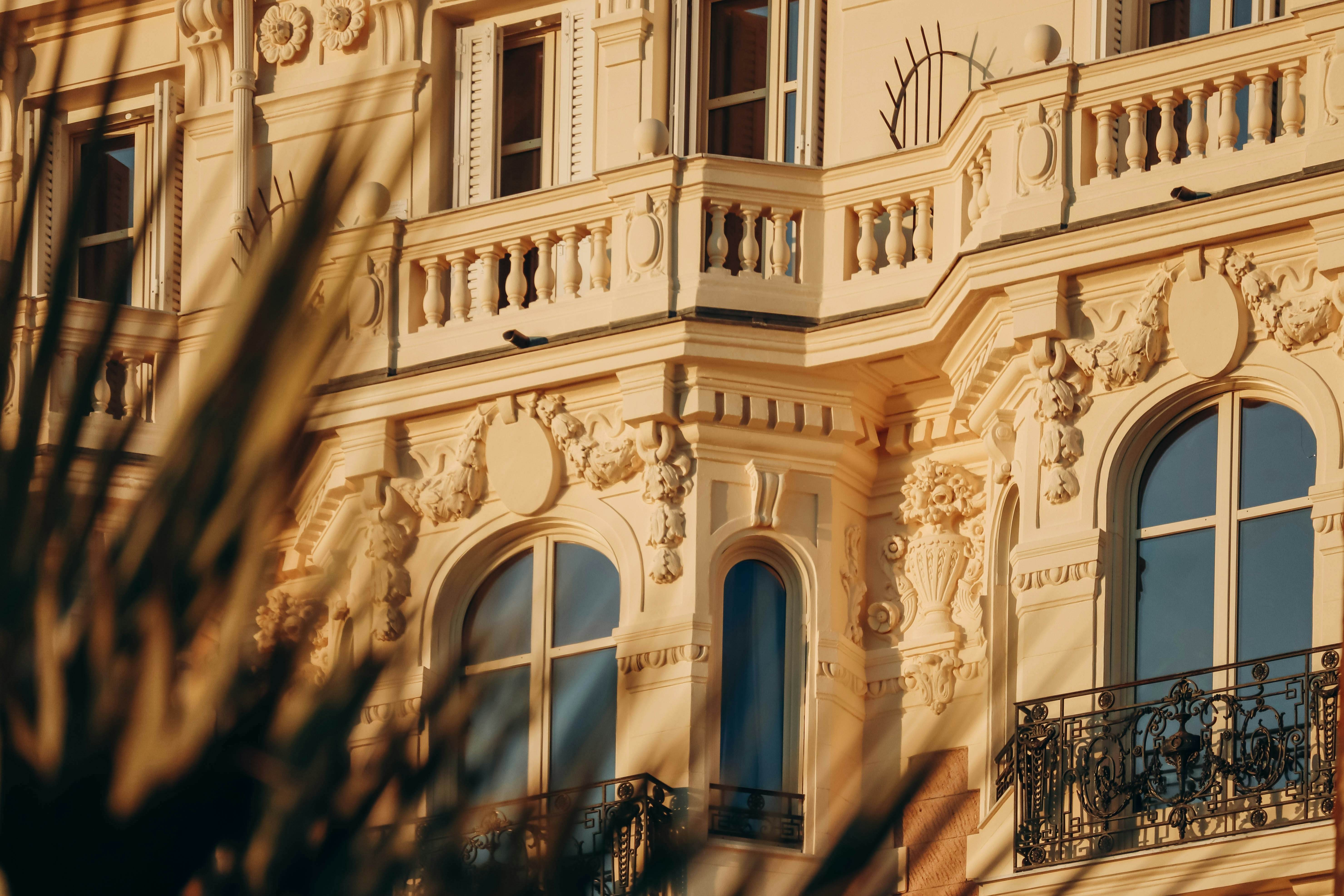 Close-up of the facade of Carlton hotel in Cannes, during the golden hour.