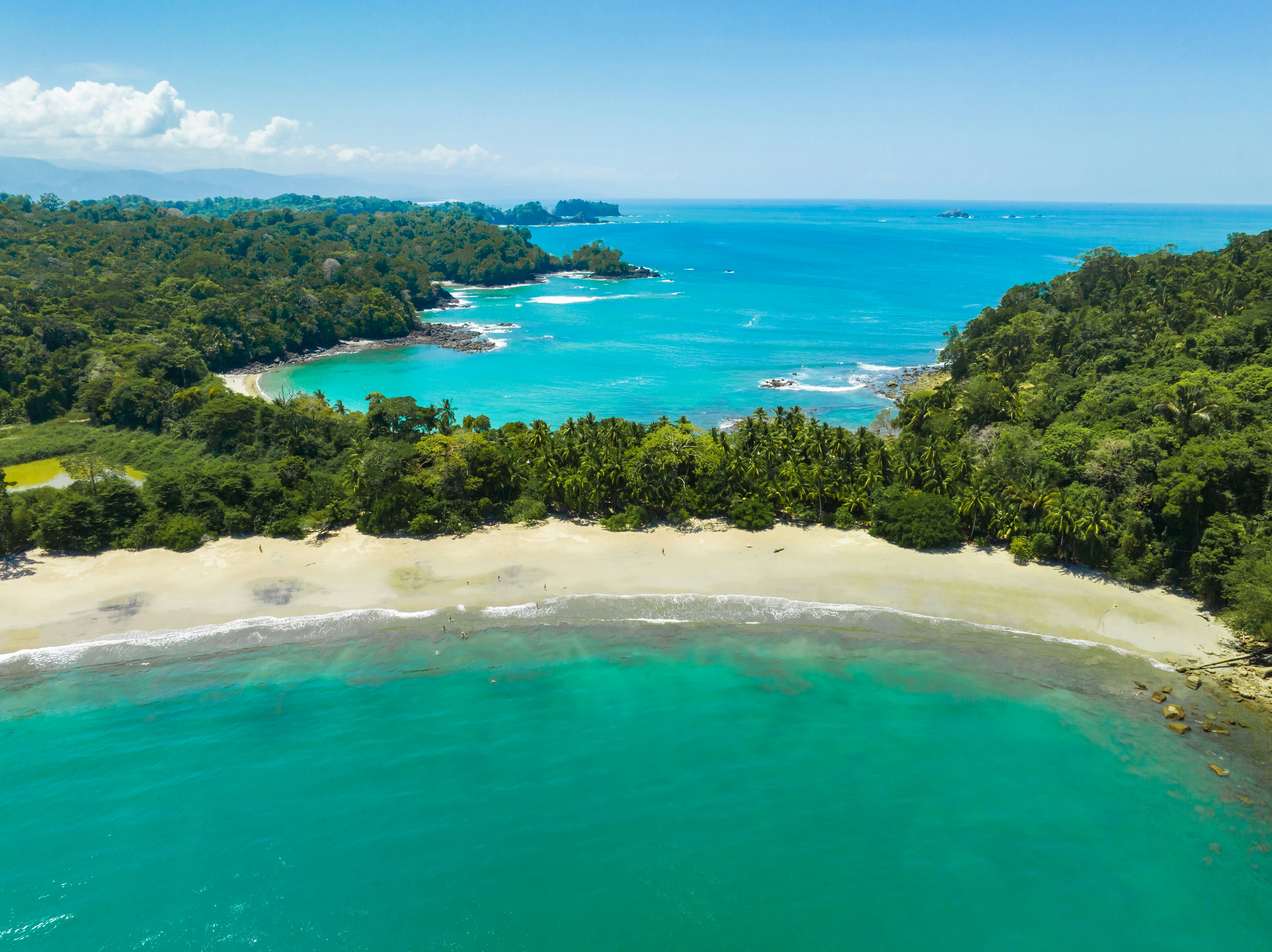Aerial view of Manuel Antonio National Park in Costa Rica. The best Tourist Attraction and Nature Reserve with lots of Wildlife, Tropical Plants and paradisiacal Beaches on the Pacific Coast