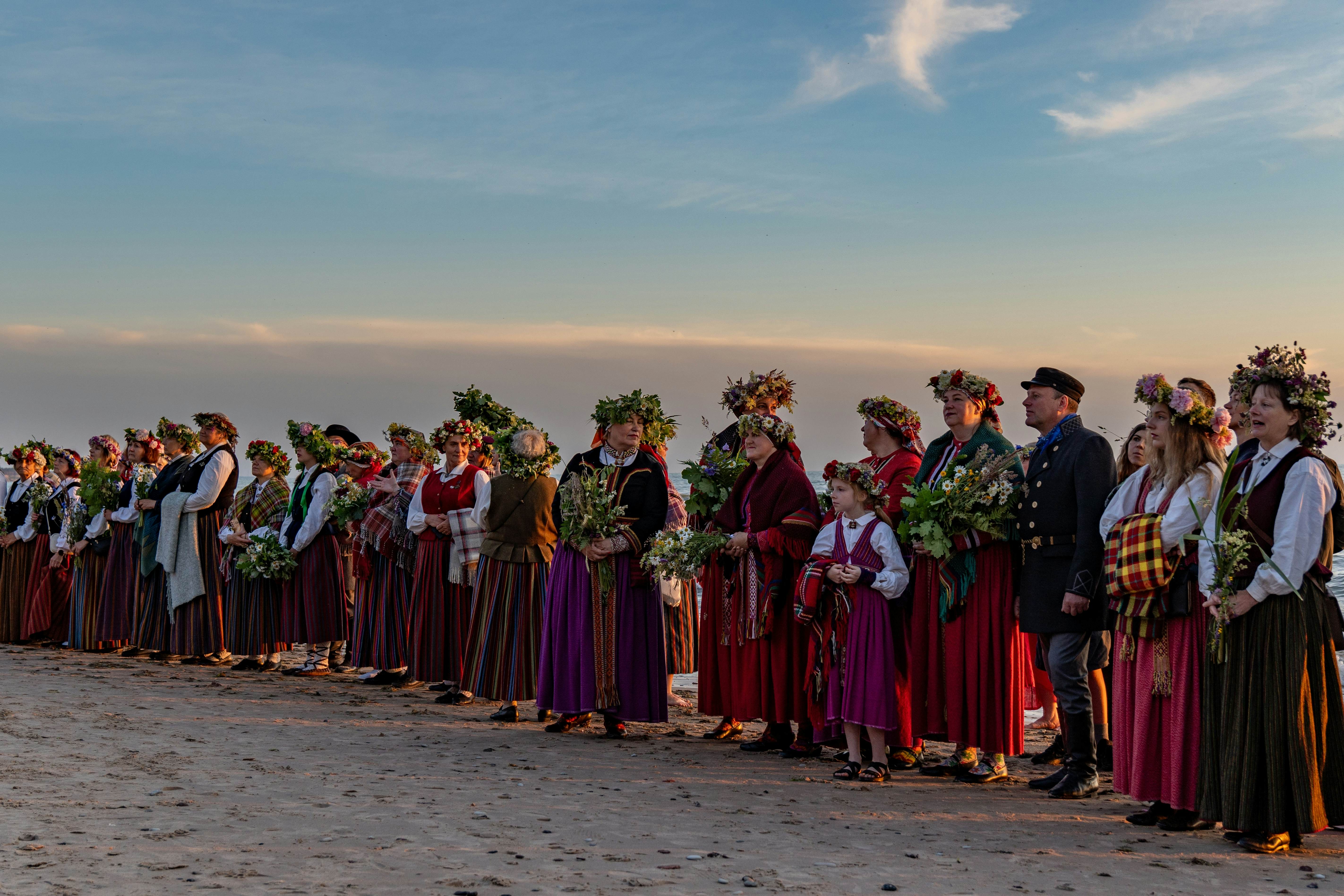 Villagers celebrate the summer solstice (Midsummer) in Jūrkalne, Ventspils, Latvia.