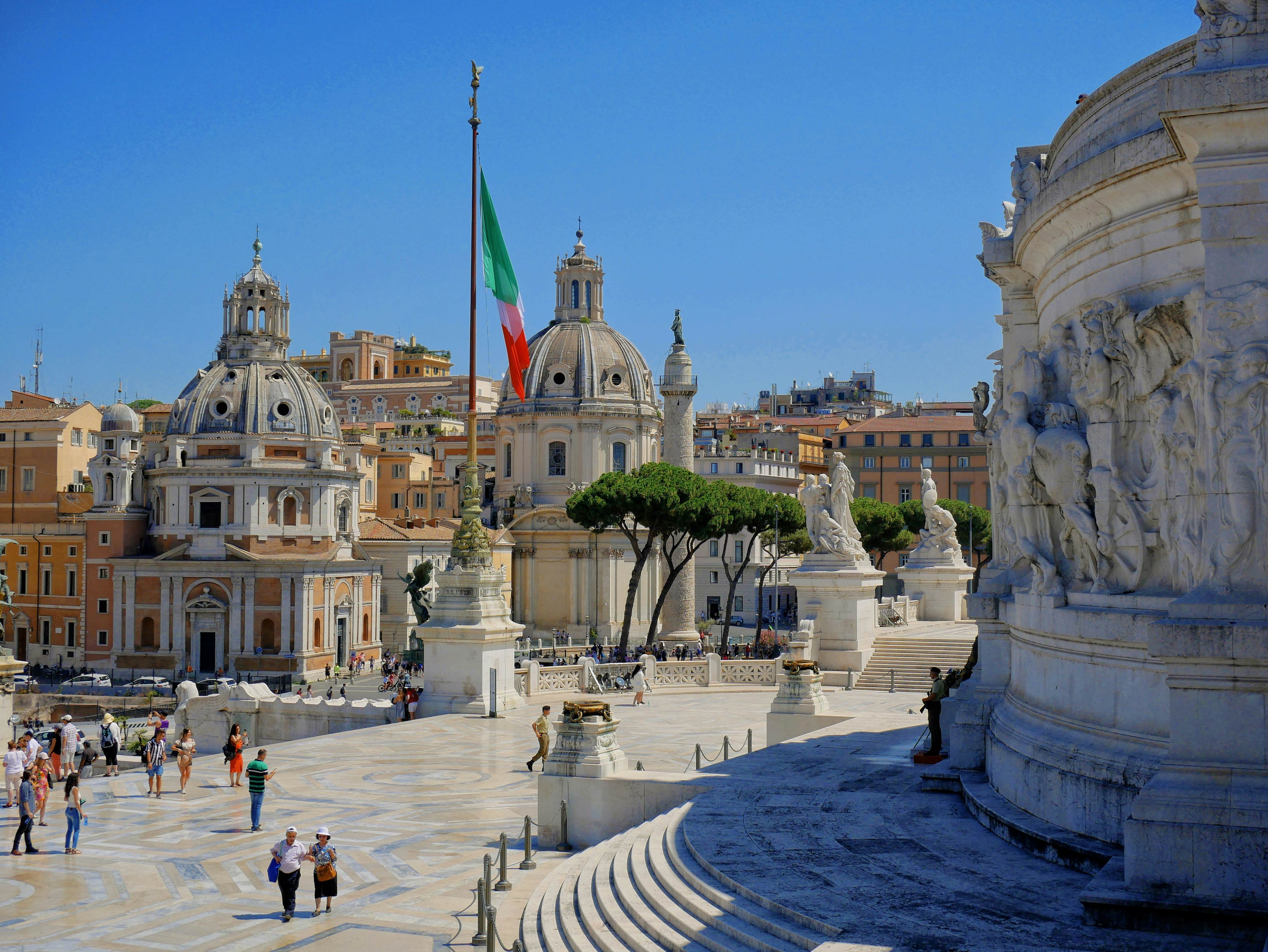 Sightseers at the Piazza Venezia in Rome, Italy.